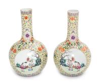 A Pair of Yellow Ground Famille Rose Porcelain Bottle Vases Height of each 9 inches. — LATE 19TH CENTURY