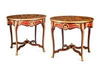 A Pair of Louis XV Style Gilt Bronze Mounted Tables with Tiger's Eye Tops