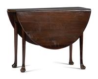 A George III Carved Mahogany Drop-Leaf Table