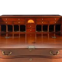 A Chippendale Walnut Serpentine Slant-Front Bureau