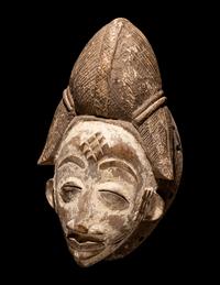 Four Punu Wood Masks