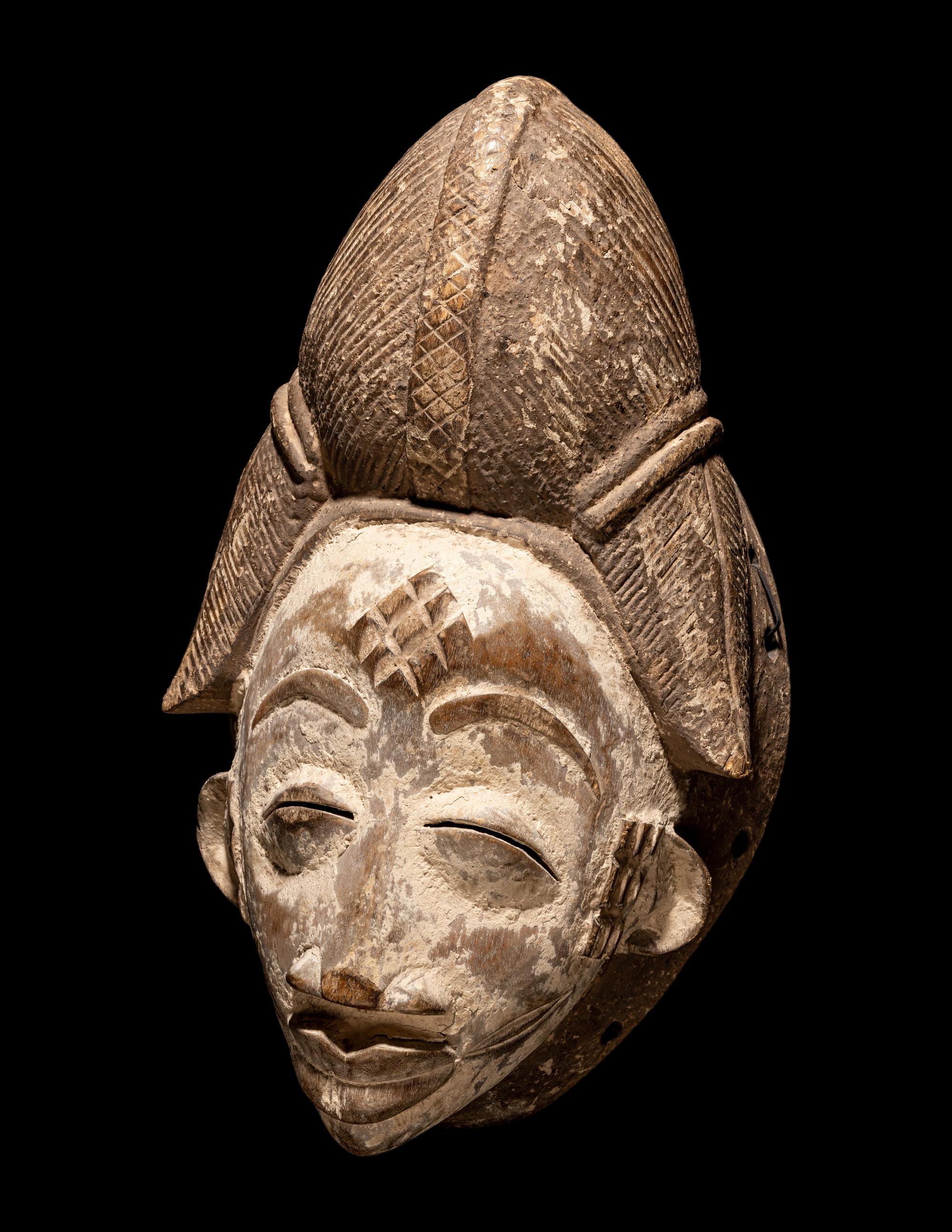 Four Punu Wood Masks