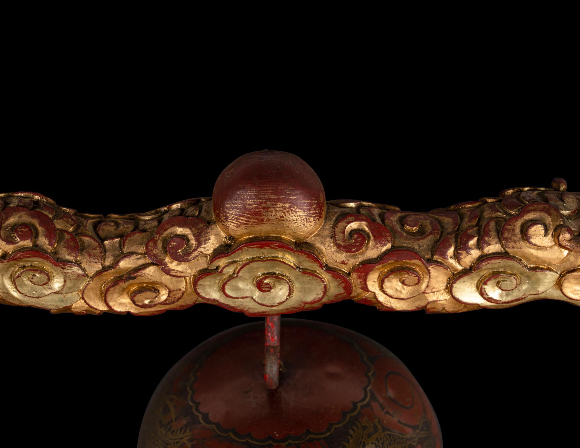 A Set of Gongs with Matching Carved Gilt and Red Lacquered Wood Stand