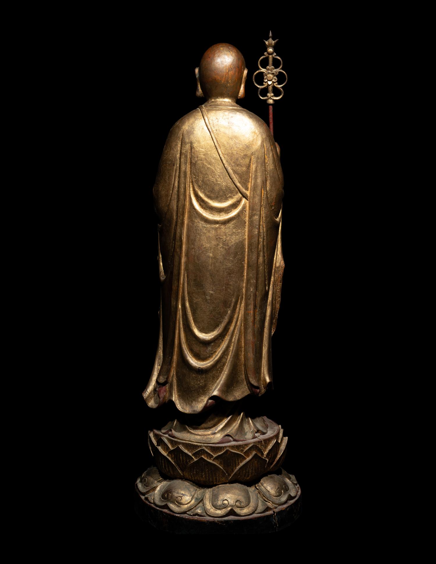 A Chinese Gilt and Lacquered Wood Figure of a Standing Monk