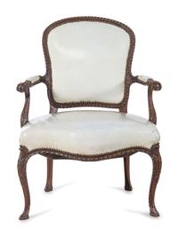 A Pair of George III Carved Mahogany Open Armchairs Attributed to John Cobb (British, c. 1710-1778)
