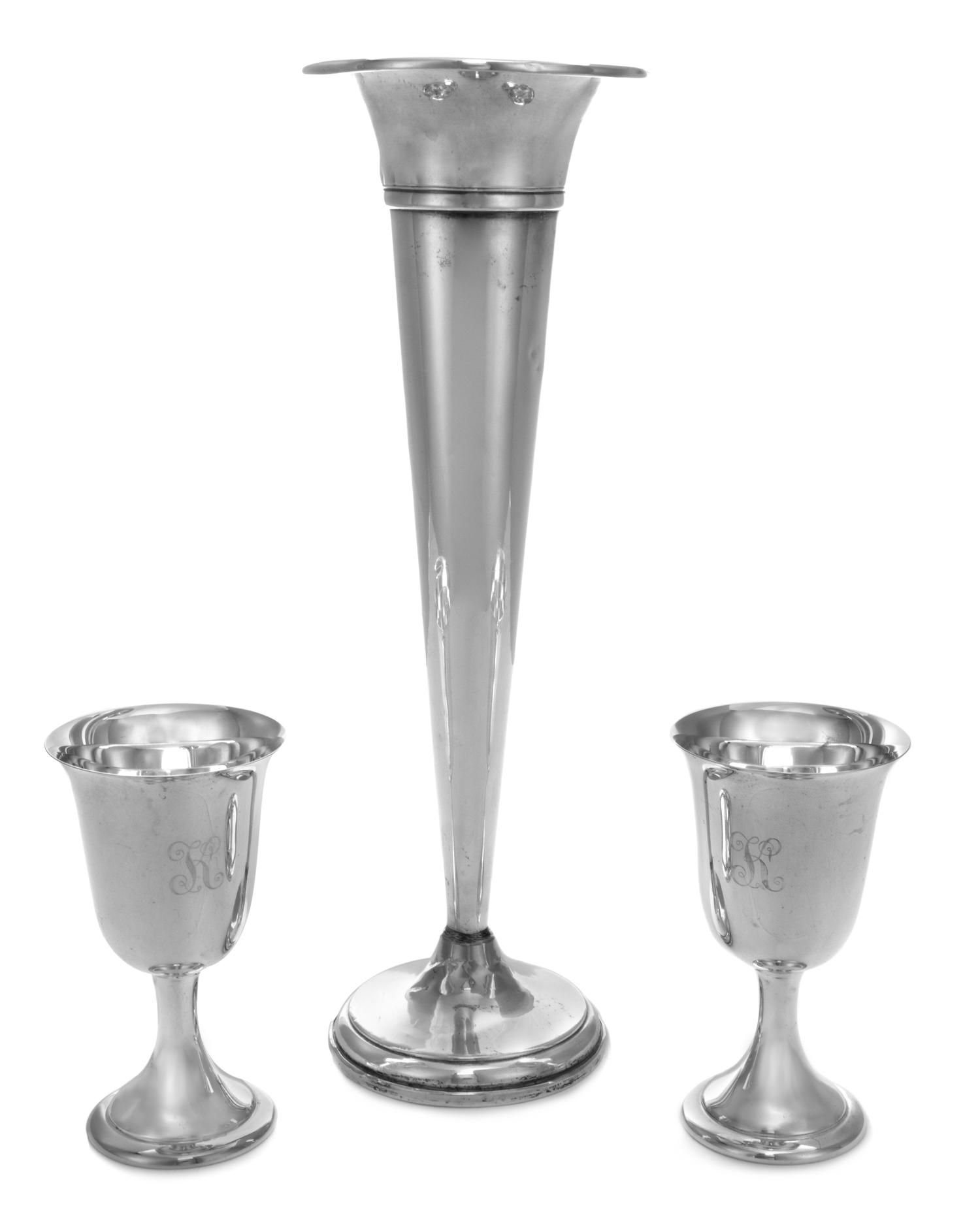 An American Silver Trumpet Vase, Various Makers, of elongated tapering form and raised on a circular weighted foot, together with two f