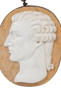 A Set of Four Carved Marble and Iron Mounted Profile Plaques