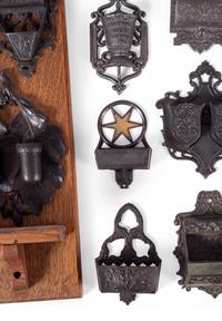 A Group of Cast Iron Hanging Match Holders