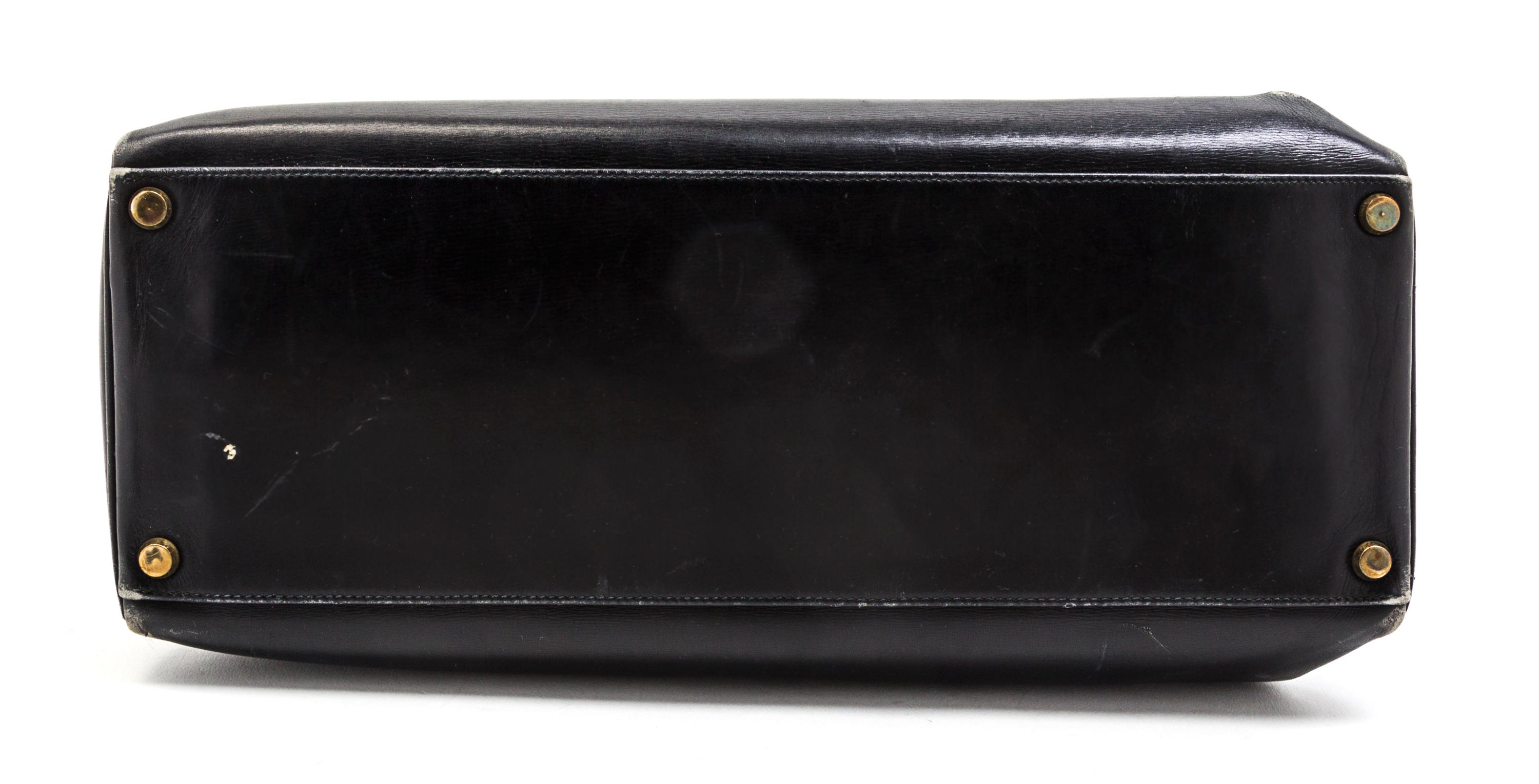 An Hermes 35cm Black Leather Kelly Bag, 14 x 8 x 7 inches.