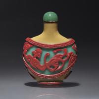 A Chinese Carved Double Overlay Glass Snuff Bottle, Qing Dynasty, Circa 1800-1880 — 1800-1880年 褐地套紅綠料螭龍紋鼻煙壺