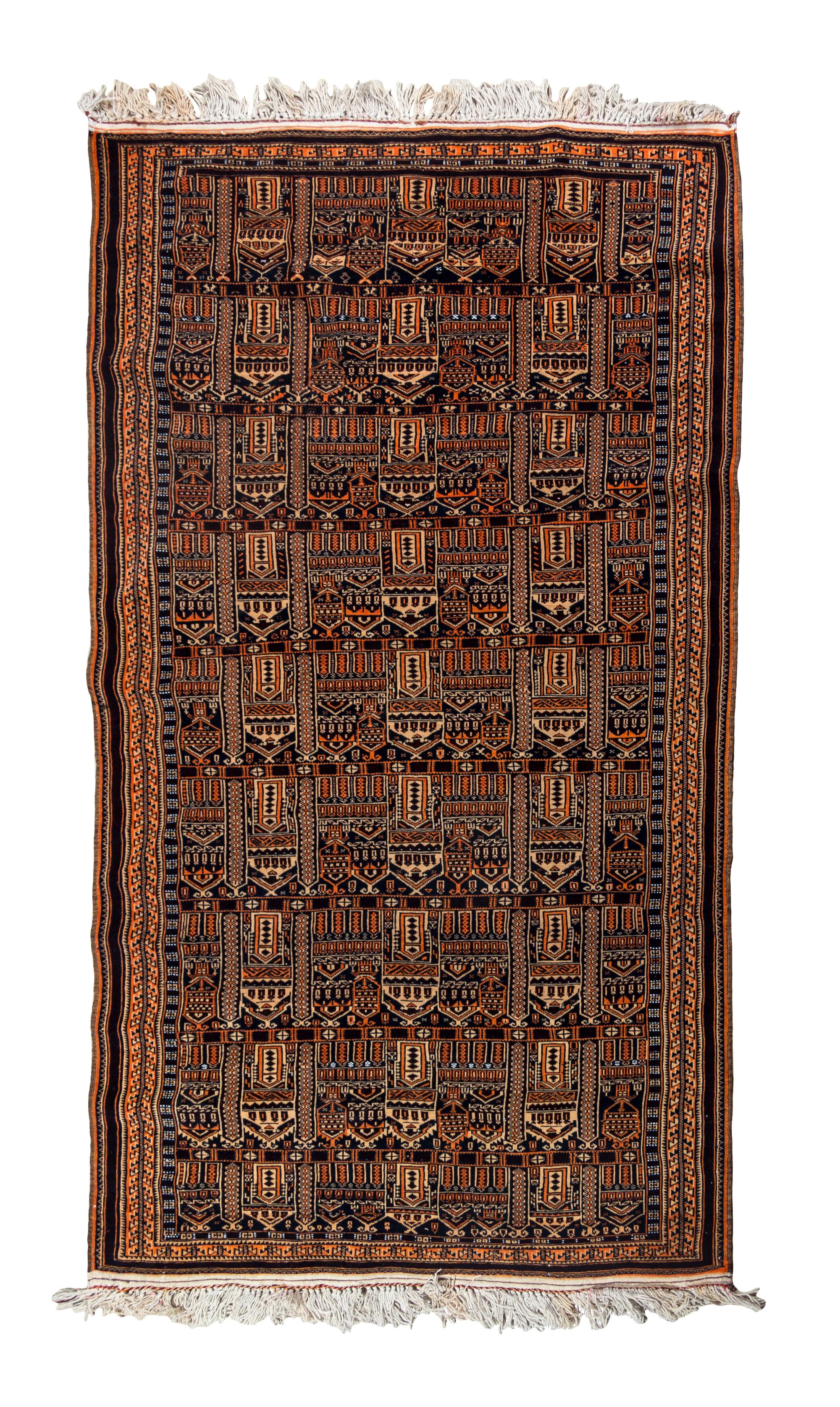 An Afghan Wool Rug 6 feet 10 inches x 3 feet 1 inch.