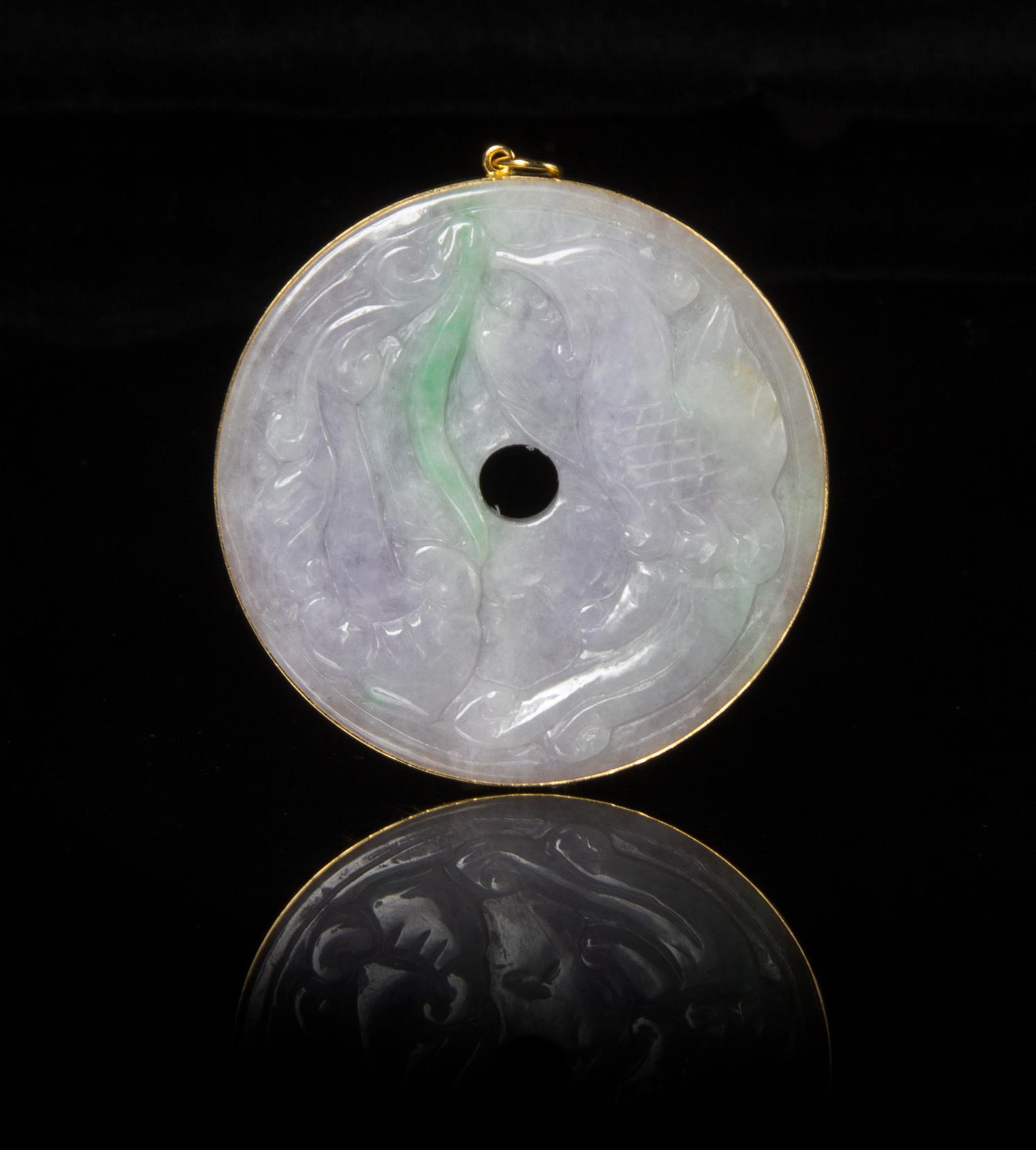 A Jadeite Bi Disc Diameter 2 1/8 inches.