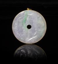 A Jadeite Bi Disc Diameter 2 1/8 inches.