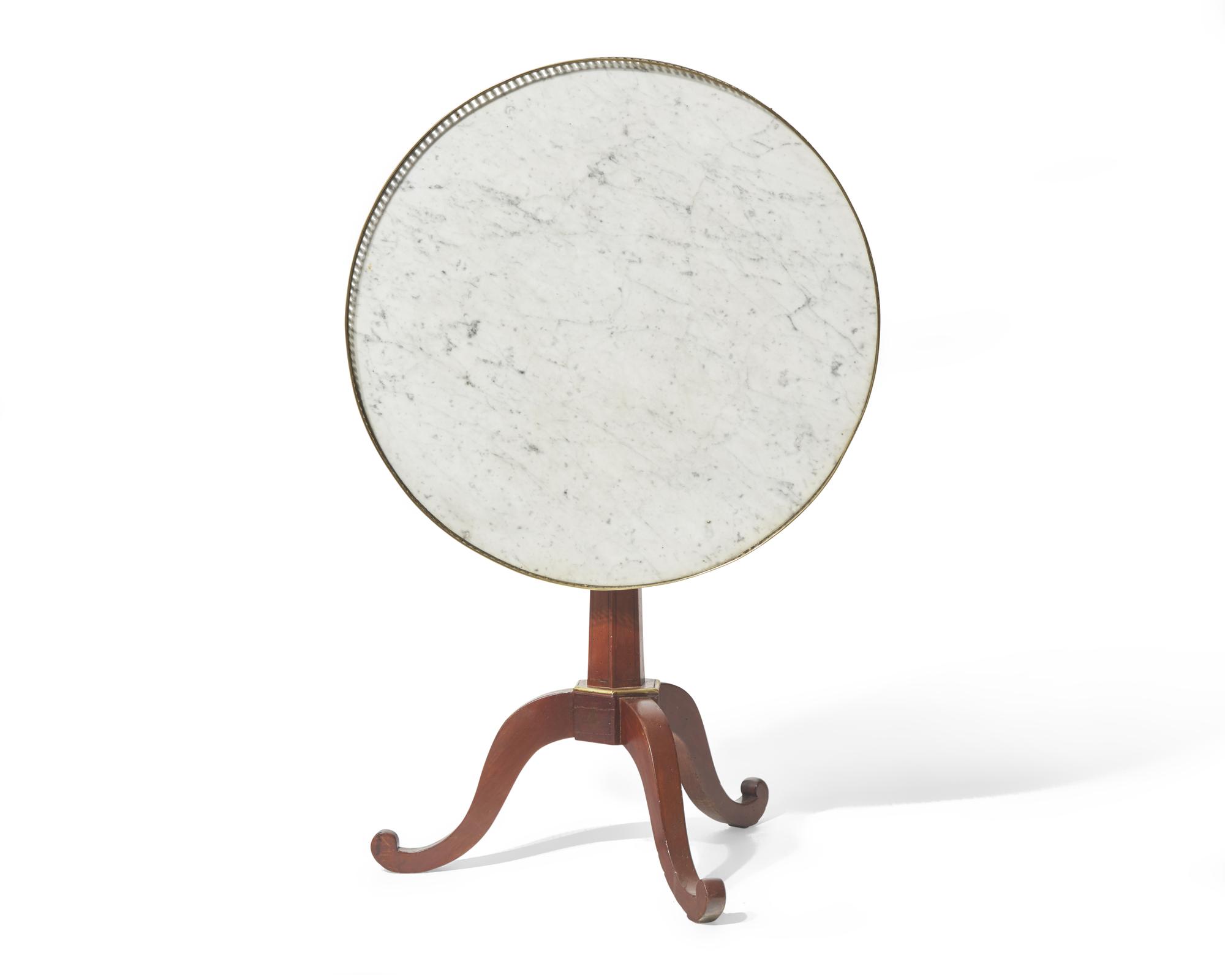 A Louis XVI inlaid fruitwood tilt-top gueridon table with white marble top, circa 1790