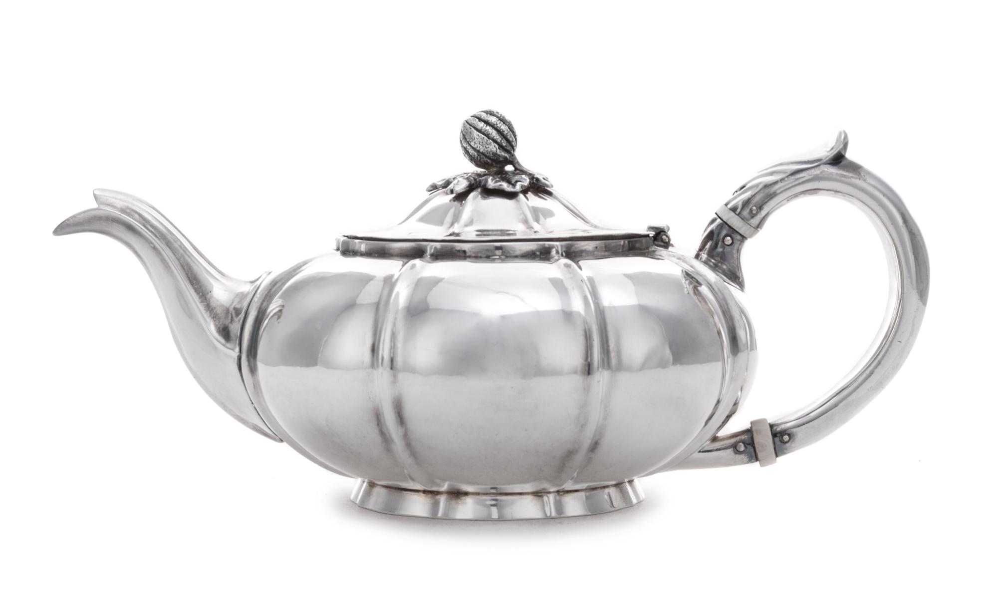 A William IV Bachelor's Teapot, Charles Gordon, London, 1832, having a gourd and foliate finial surmounting a ribbed lid and body.
