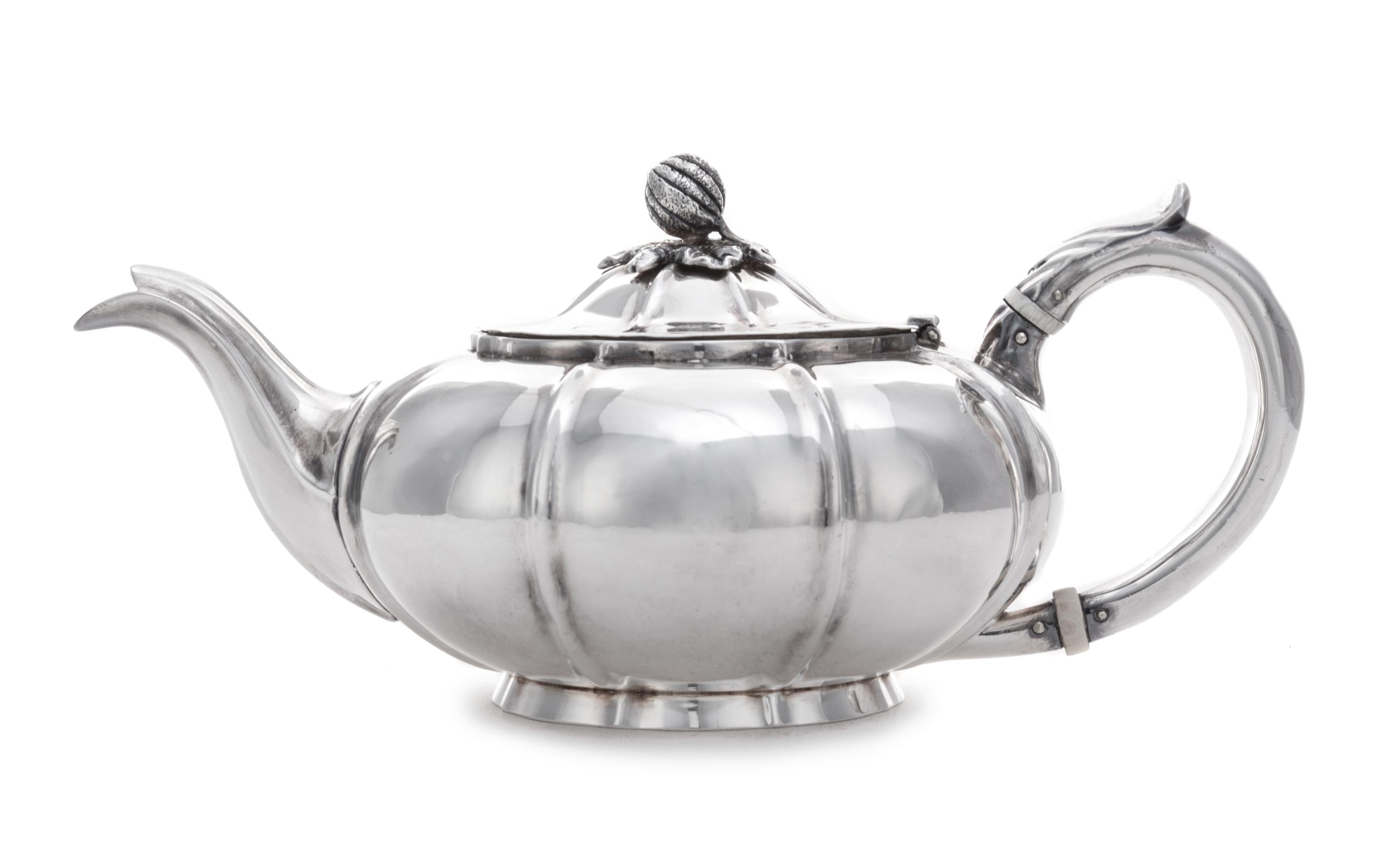 A William IV Bachelor's Teapot, Charles Gordon, London, 1832, having a gourd and foliate finial surmounting a ribbed lid and body.