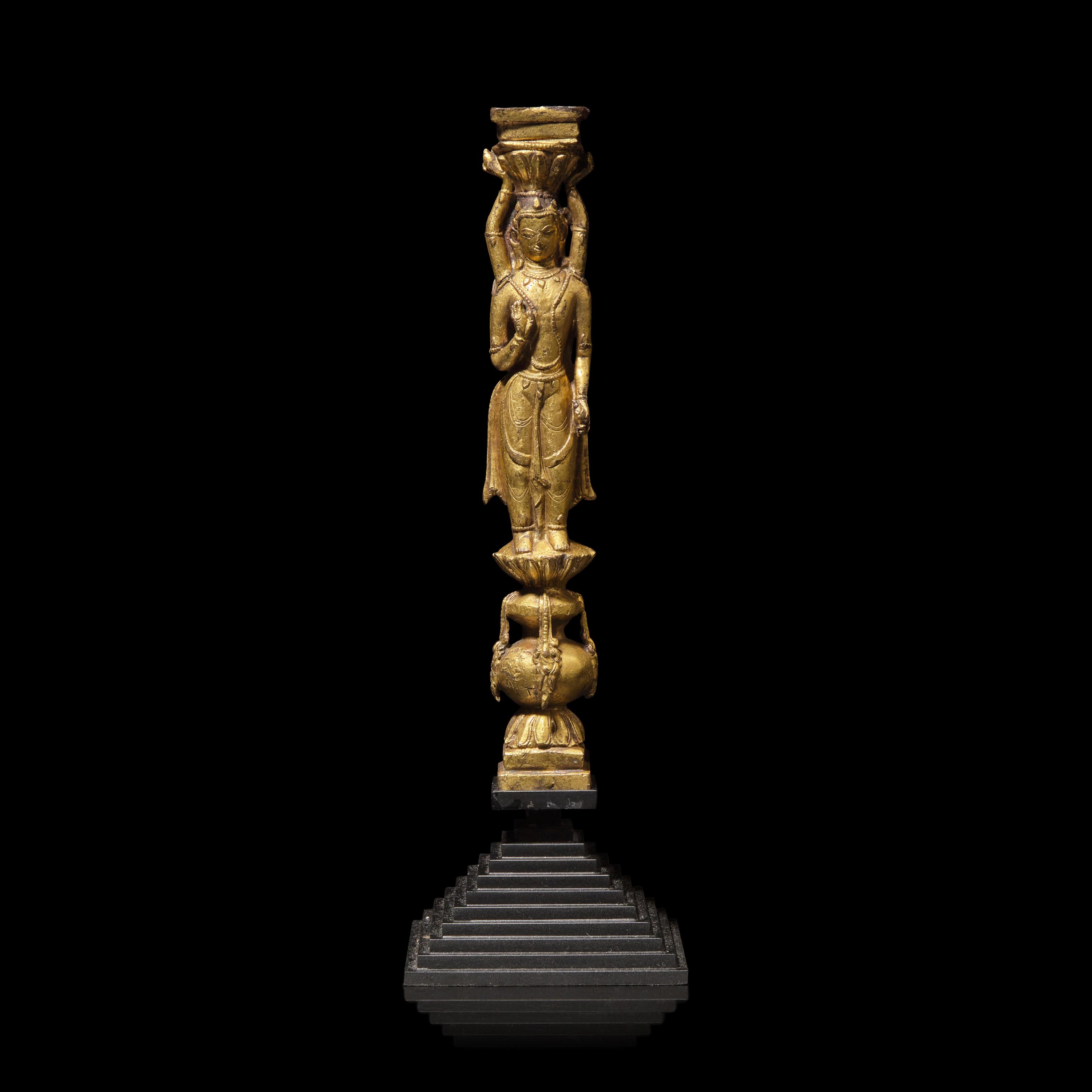 A Tibetan Gilt Copper Alloy Double-Sided Stupa Column Support, Densatil Monastery, 14th/Early 15th Century