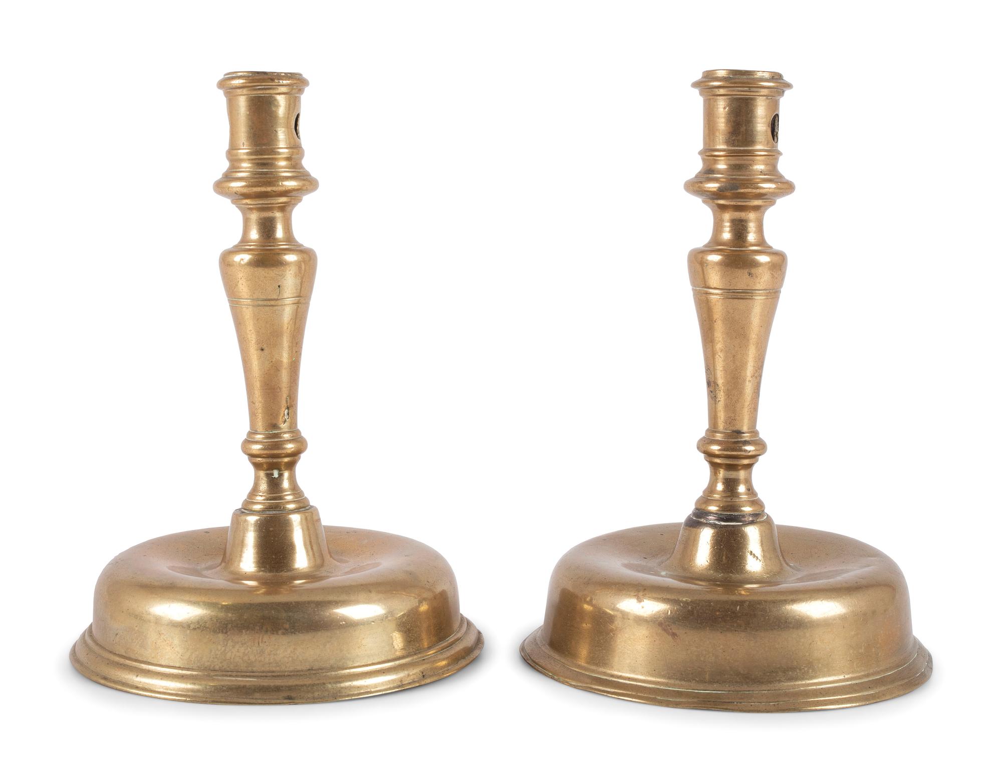A Pair of Spanish Brass Low Bell Candlesticks
