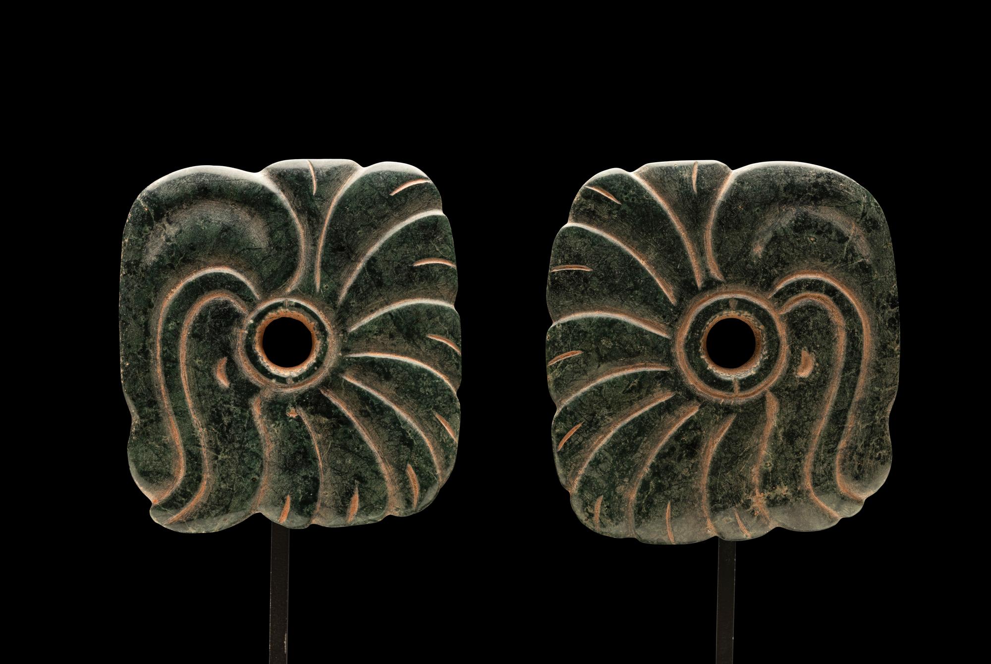 A Pair of Maya Jade Earspools in the Form of a Quetzal Bird