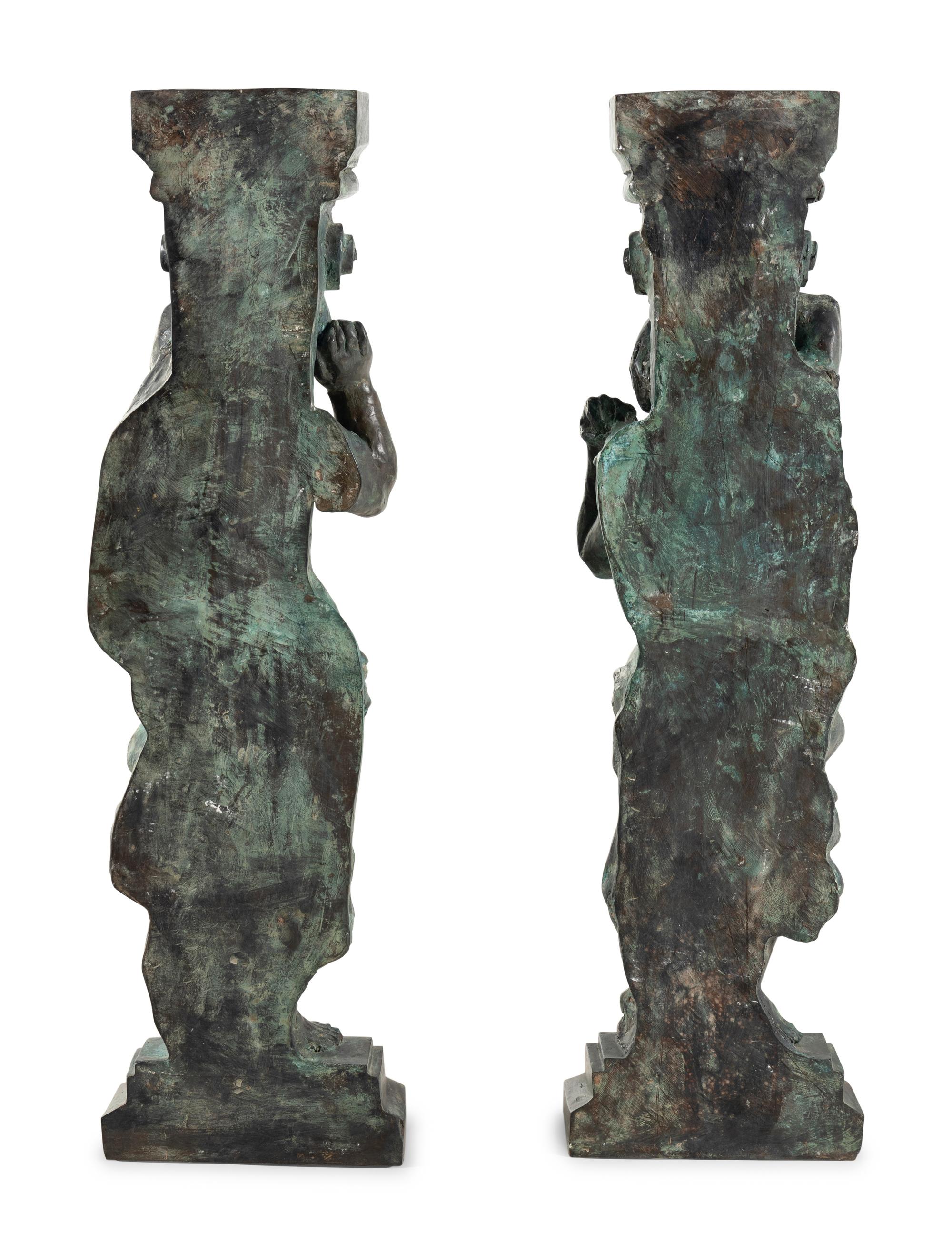 A Pair of Continental Cast Metal Figural Pedestals