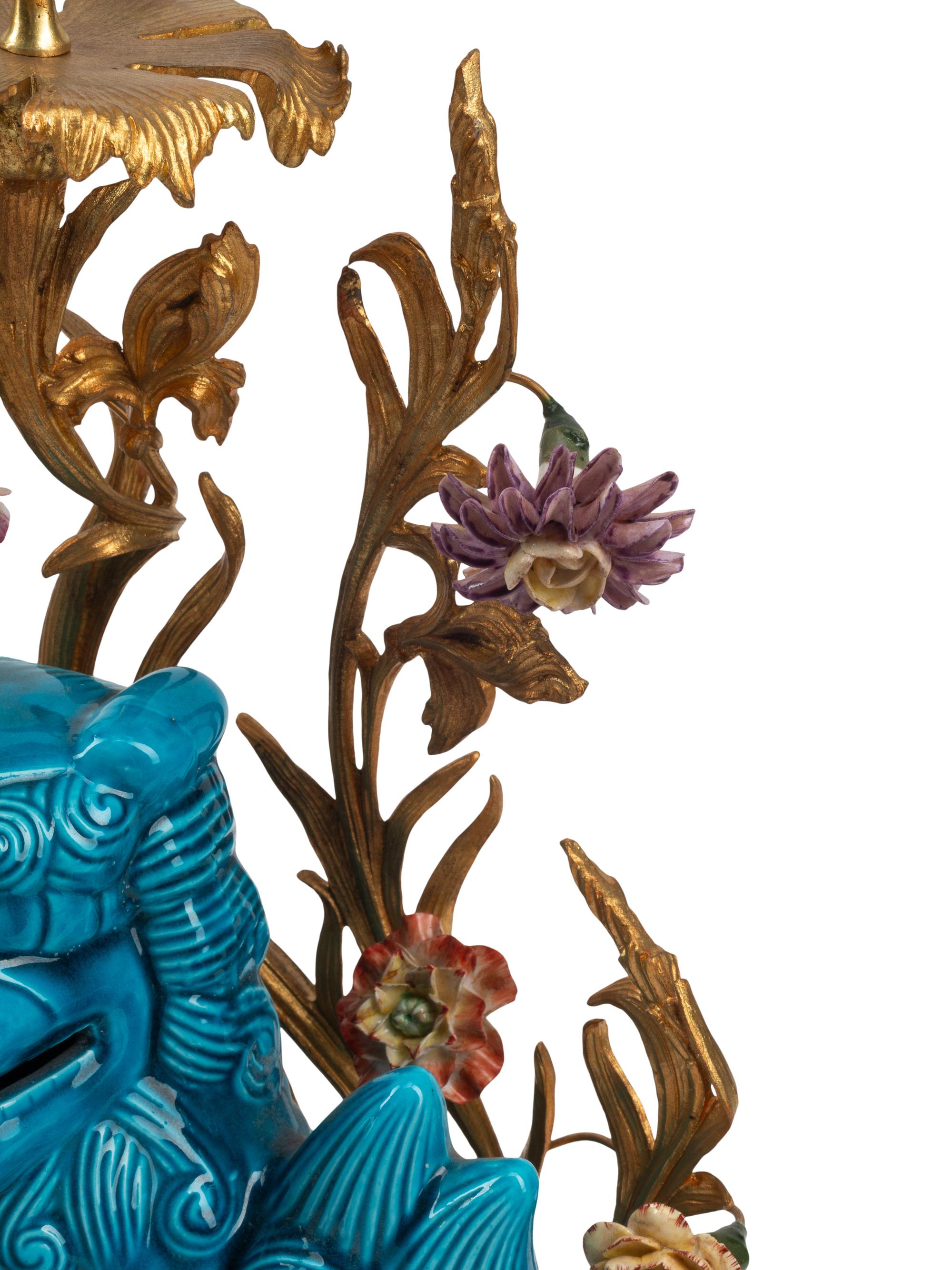 A Pair of French Gilt Bronze Mounted Turquoise Glazed Porcelain Guardian Lion Candelabra