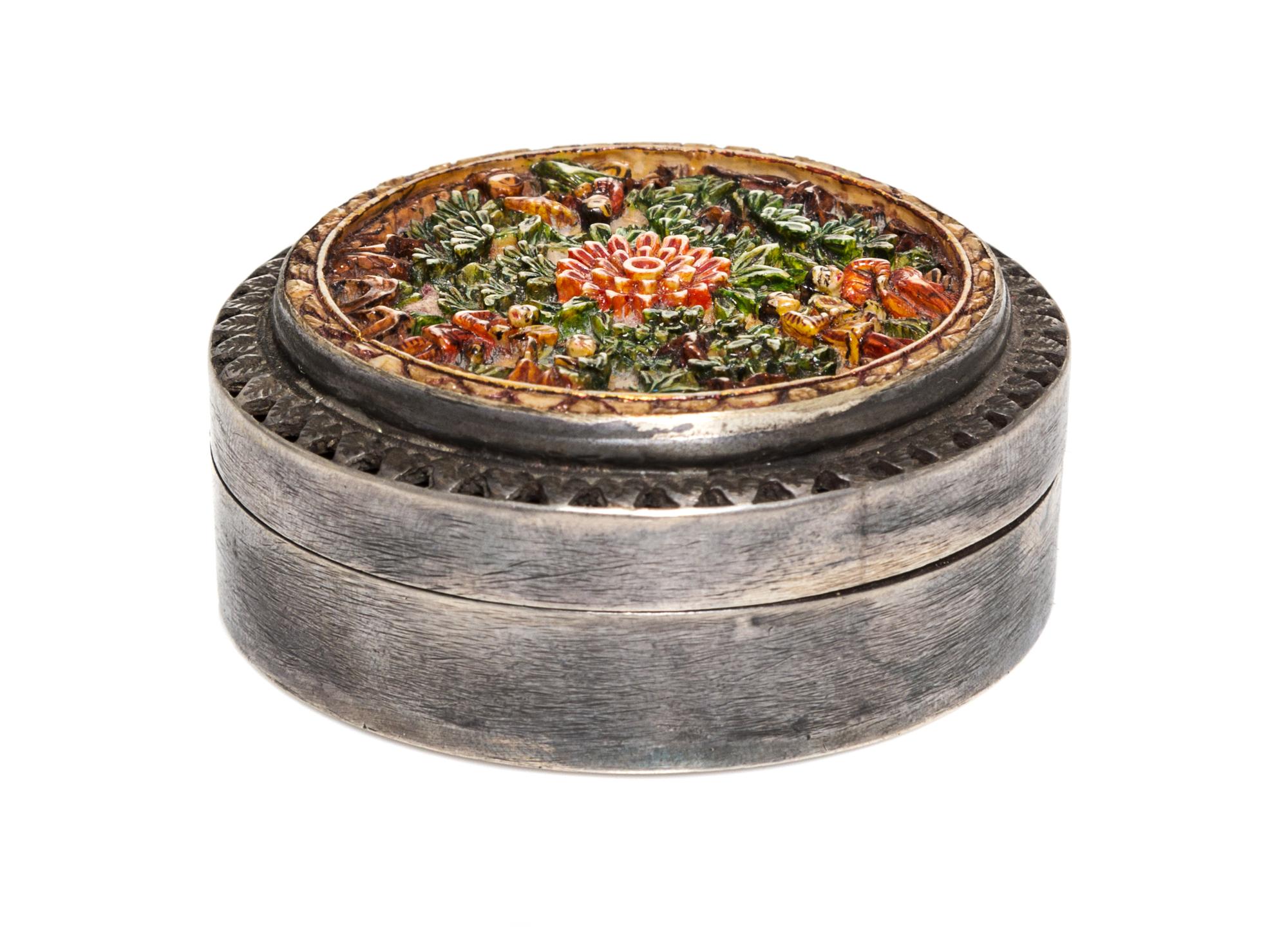 A Chinese Cast Metal Box, Early 20th Century, of circular form with carved floral decoration.