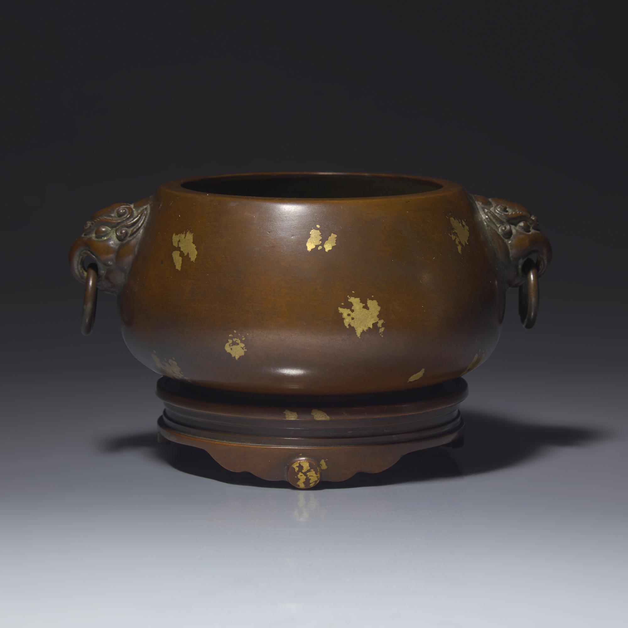 A Chinese Patinated and 'Gold-Splashed' Copper Alloy Censer and Stand — 銅灑金雙耳爐