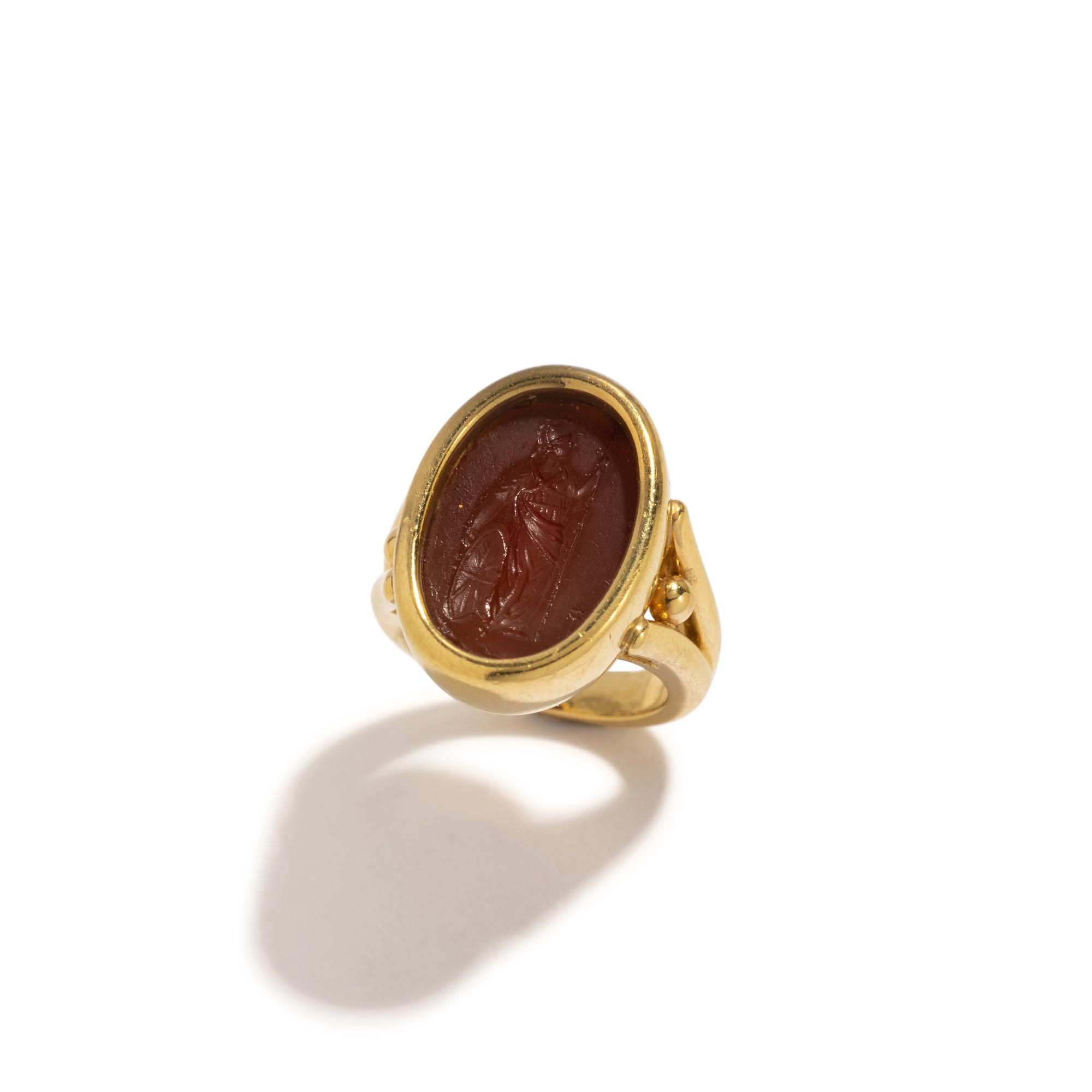 A Roman Carnelian Ring Stone with the Goddess Minerva — Set in a gold ring