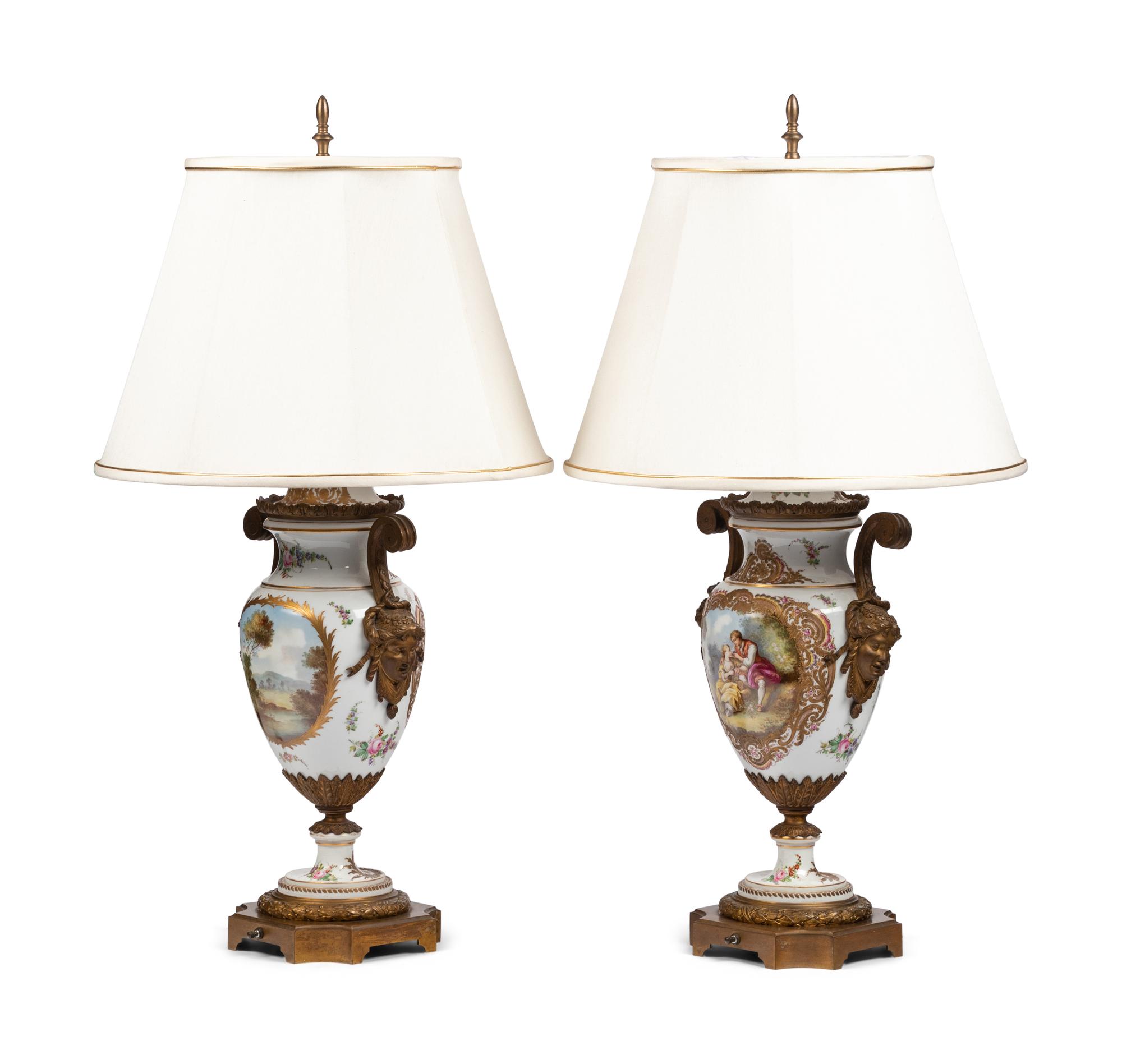 A Pair of Gilt Bronze Mounted Sèvres Style Porcelain Urns Mounted as Lamps