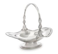 An American Silver Centerpiece Basket, Frank M. Whiting & Co., North Attleboro, MA, the pierce-decorated handle and body with repousse
