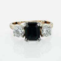 A Three Stone Sapphire and Diamond Ring