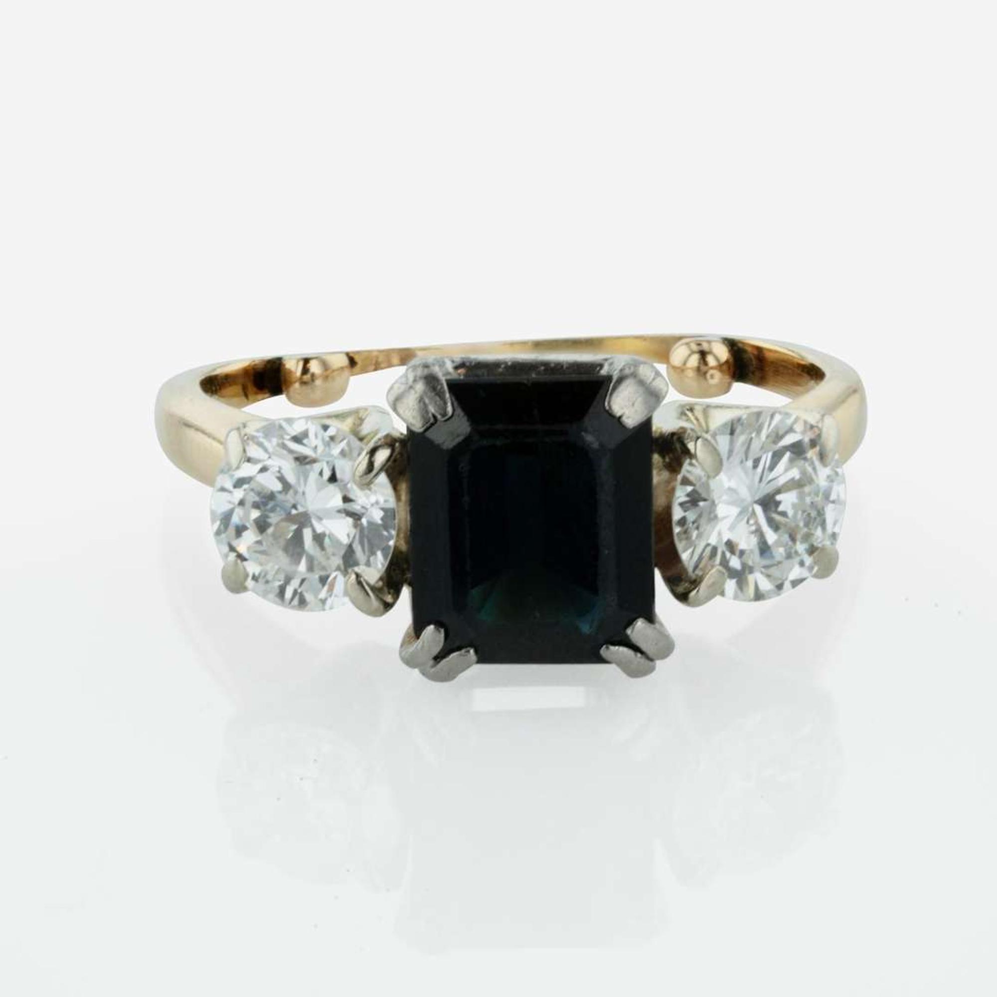 A Three Stone Sapphire and Diamond Ring