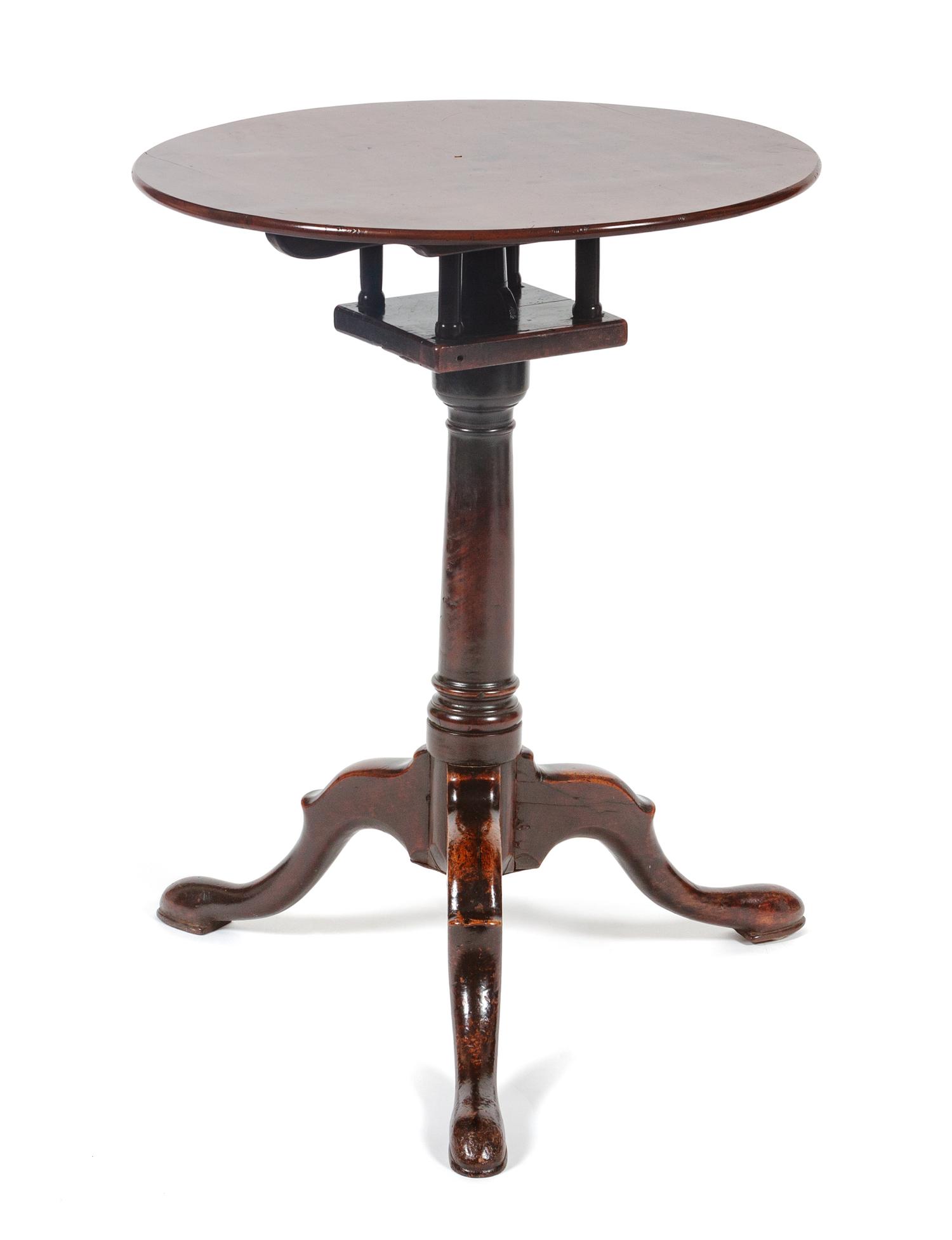A George III Mahogany Tilt-Top Table Height 25 1/2 x diameter 19 1/2 inches. — CIRCA 1800