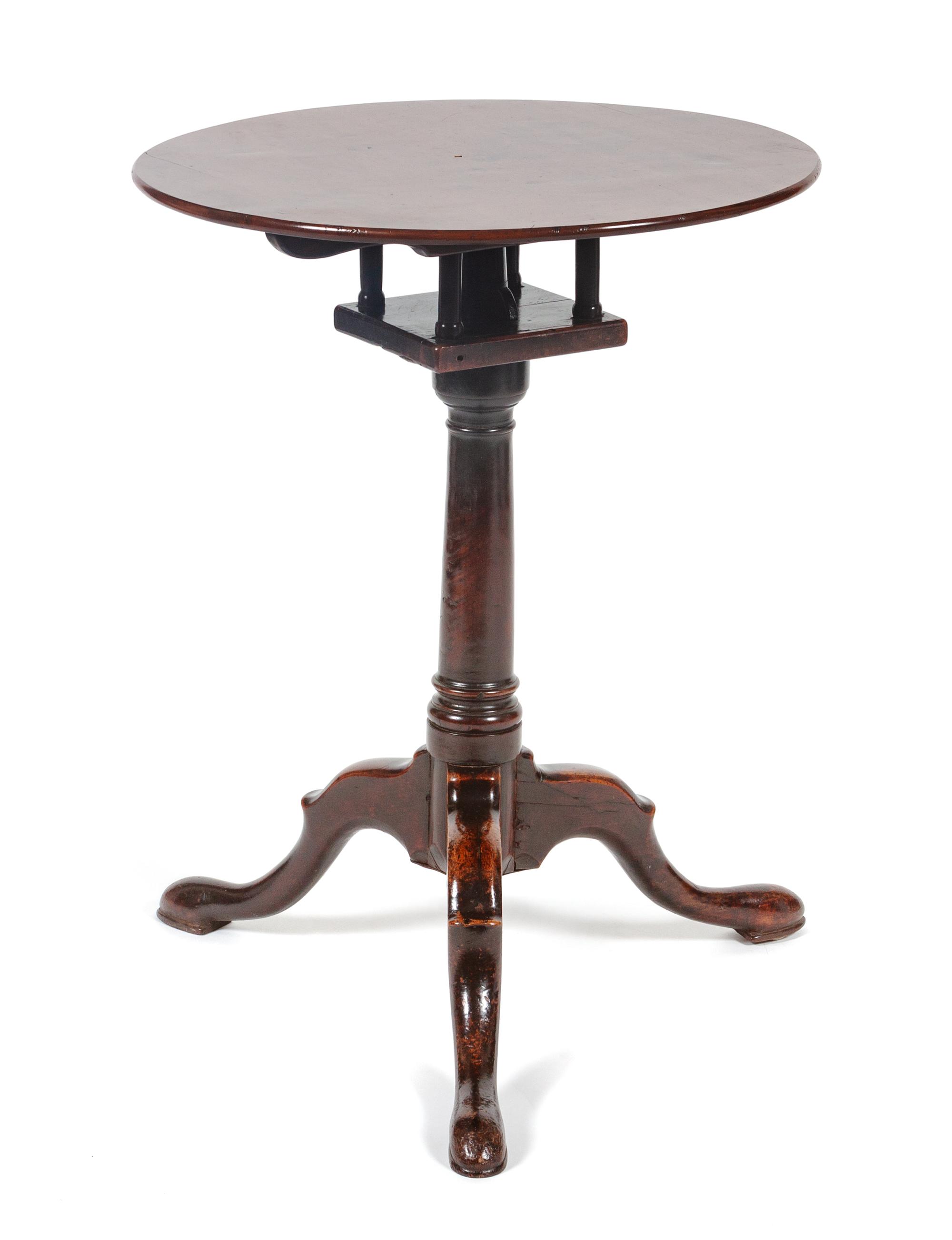 A George III Mahogany Tilt-Top Table Height 25 1/2 x diameter 19 1/2 inches. — CIRCA 1800