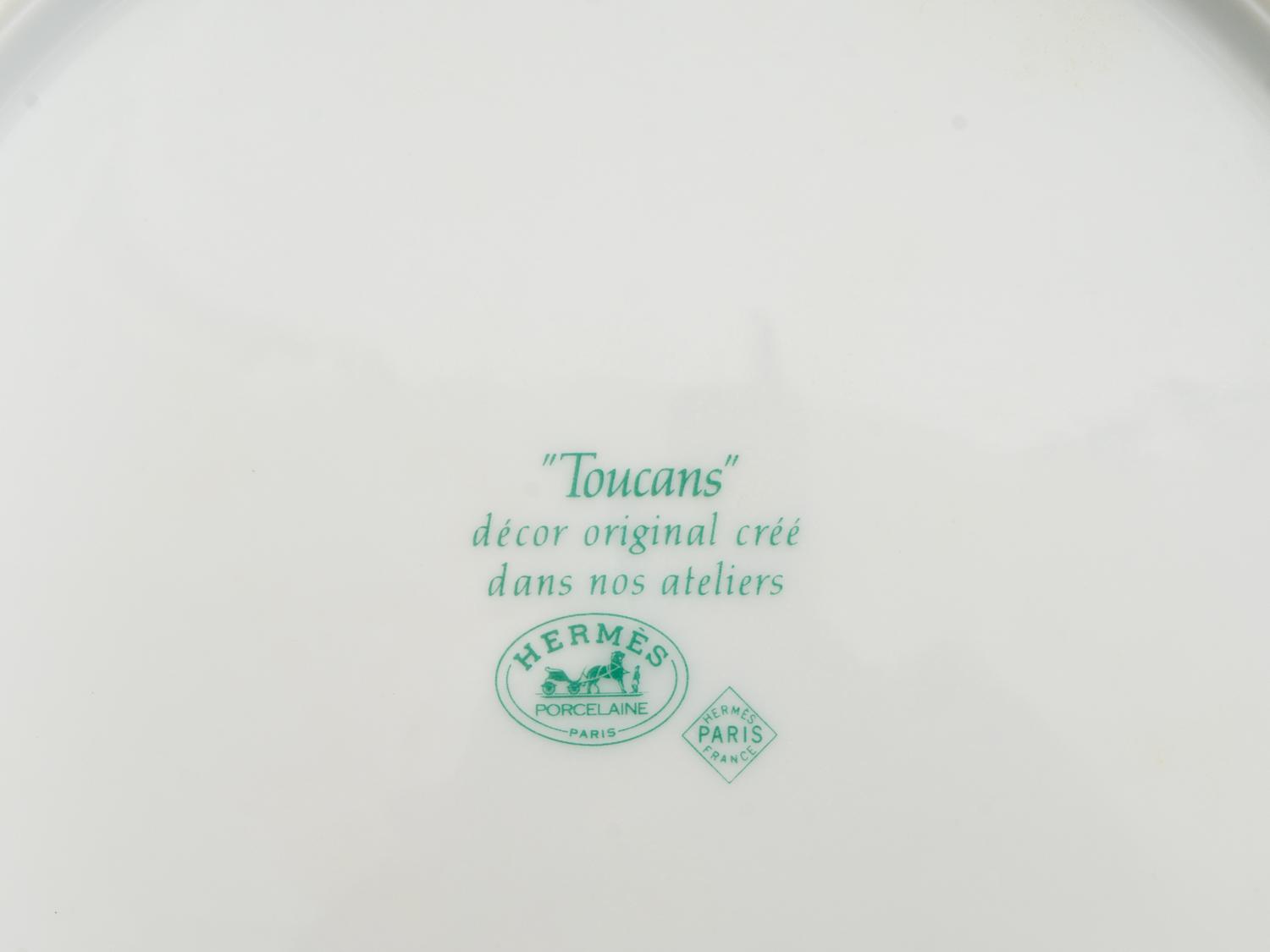 An Hermès Toucans Porcelain Dinner Service