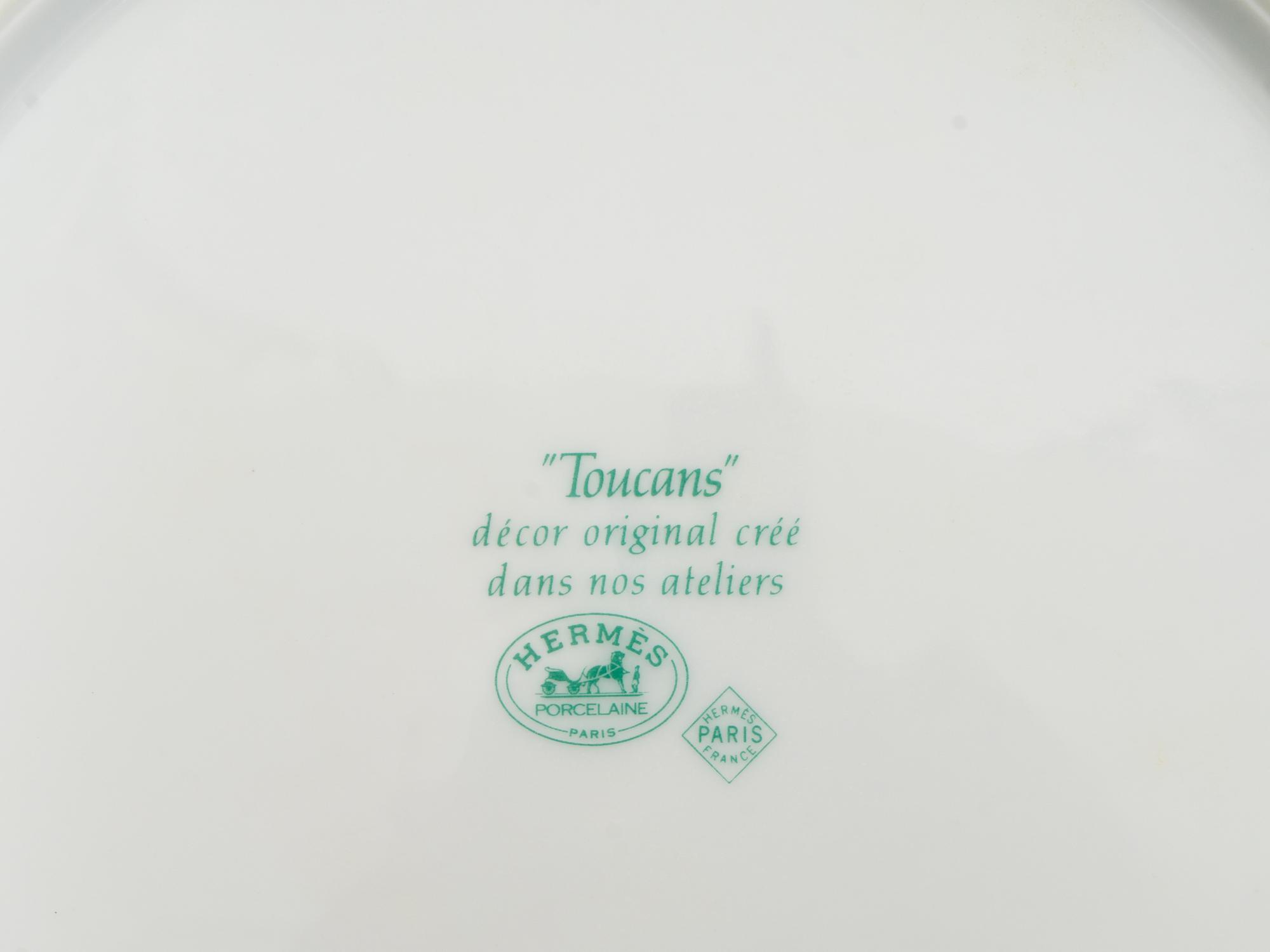 An Hermès Toucans Porcelain Dinner Service