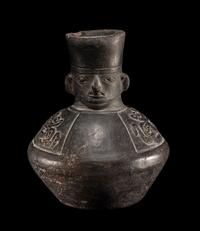 A Chimu Blackware Vessel with Human Face and Animal Motif