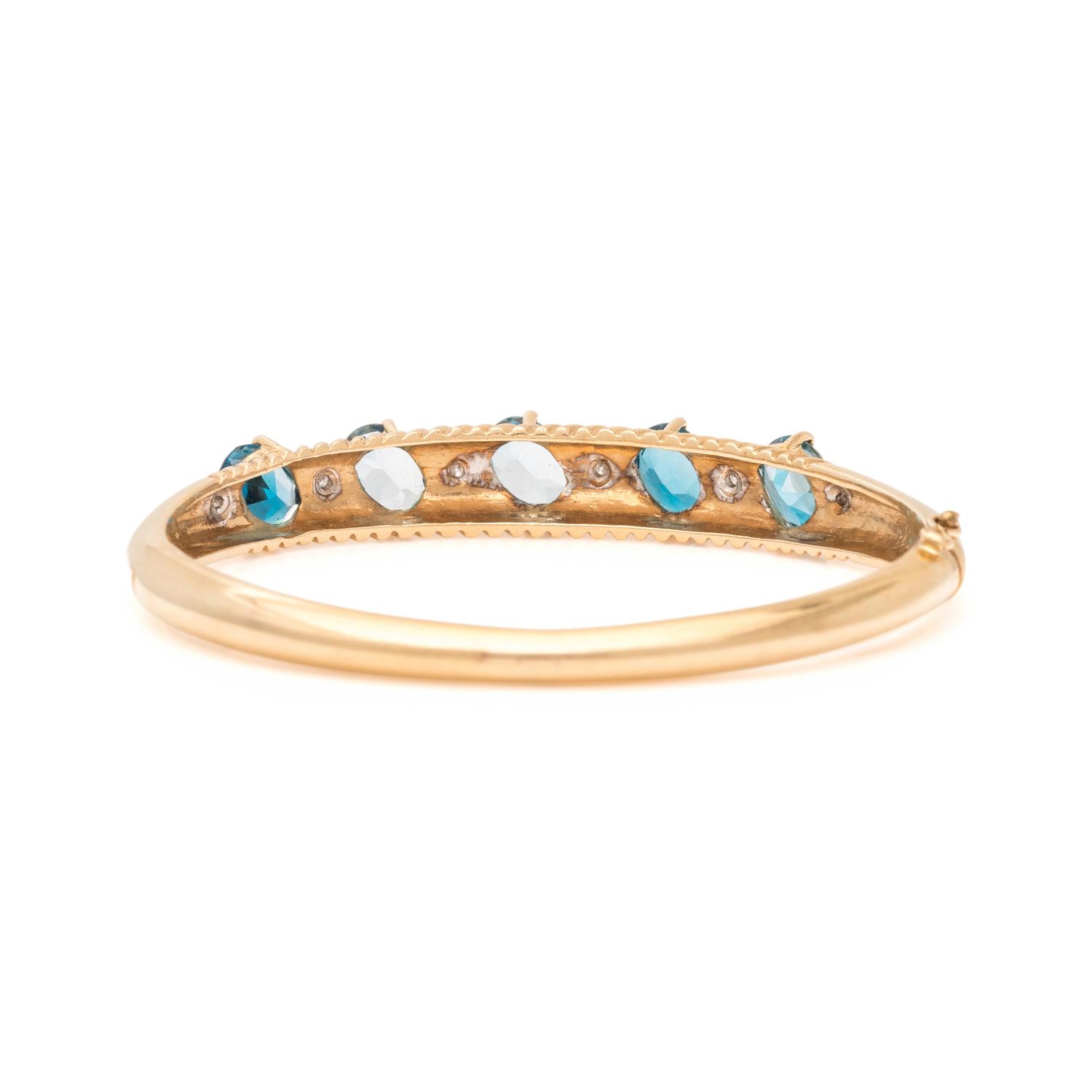 YELLOW GOLD, BLUE TOPAZ AND DIAMOND BANGLE BRACELET