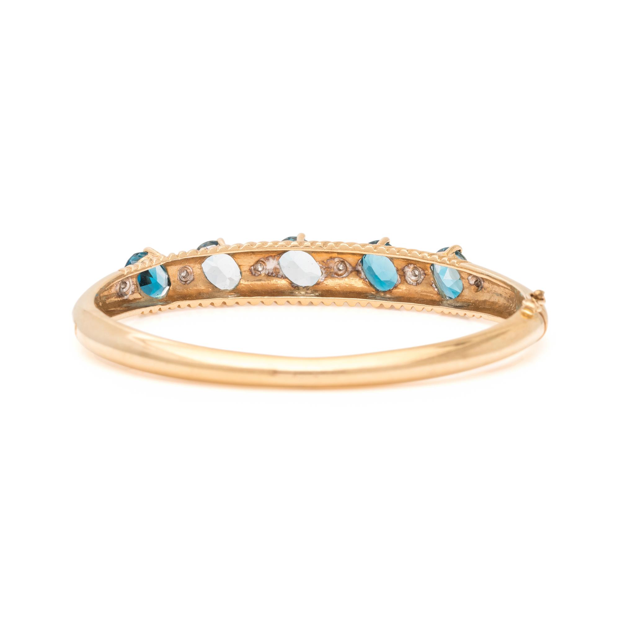 YELLOW GOLD, BLUE TOPAZ AND DIAMOND BANGLE BRACELET