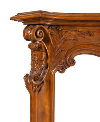 A Louis XV Style Carved Walnut Chimneypiece