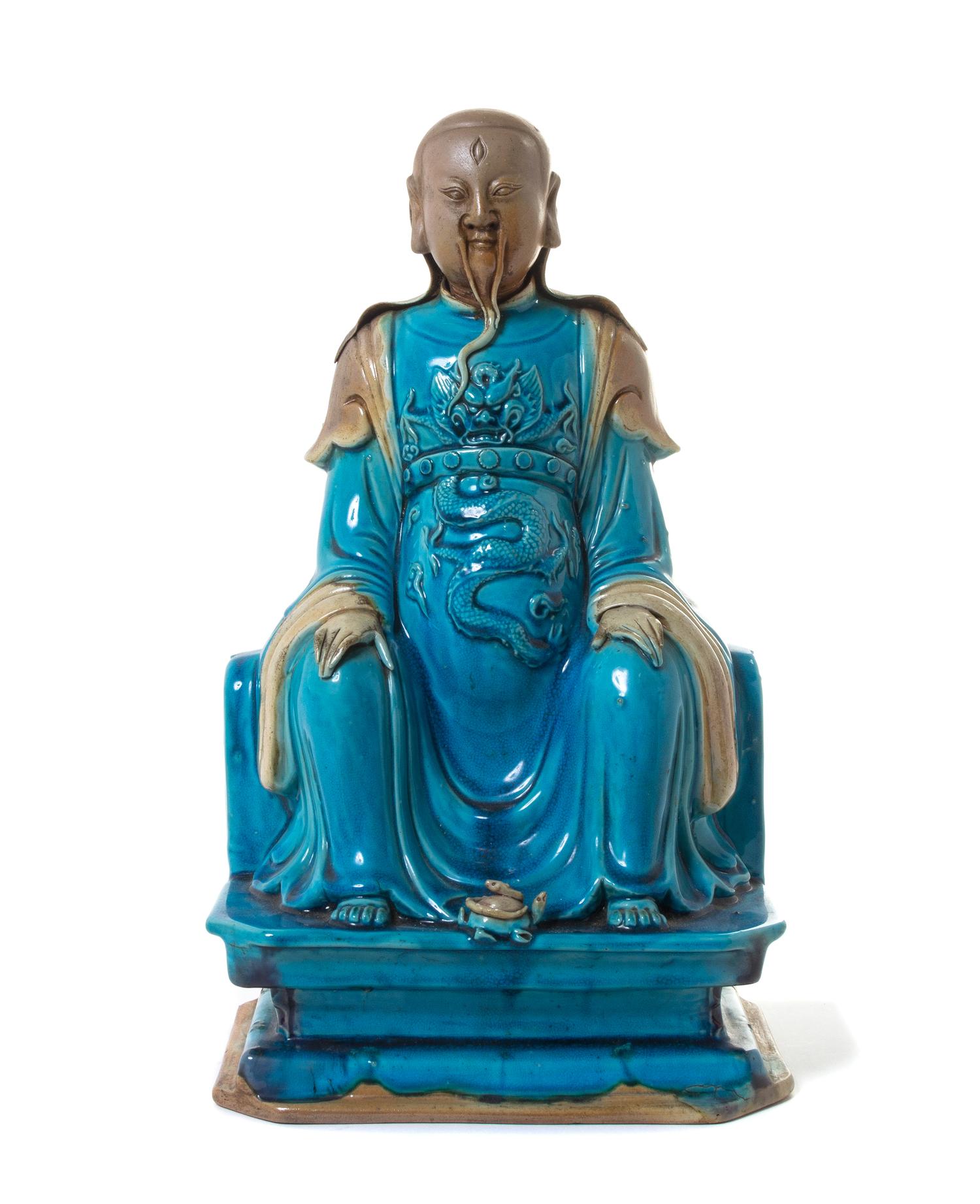 A Turquoise Glazed Biscuit Figure of a Daoist Immortal, Zhenwu — MING DYNASTY