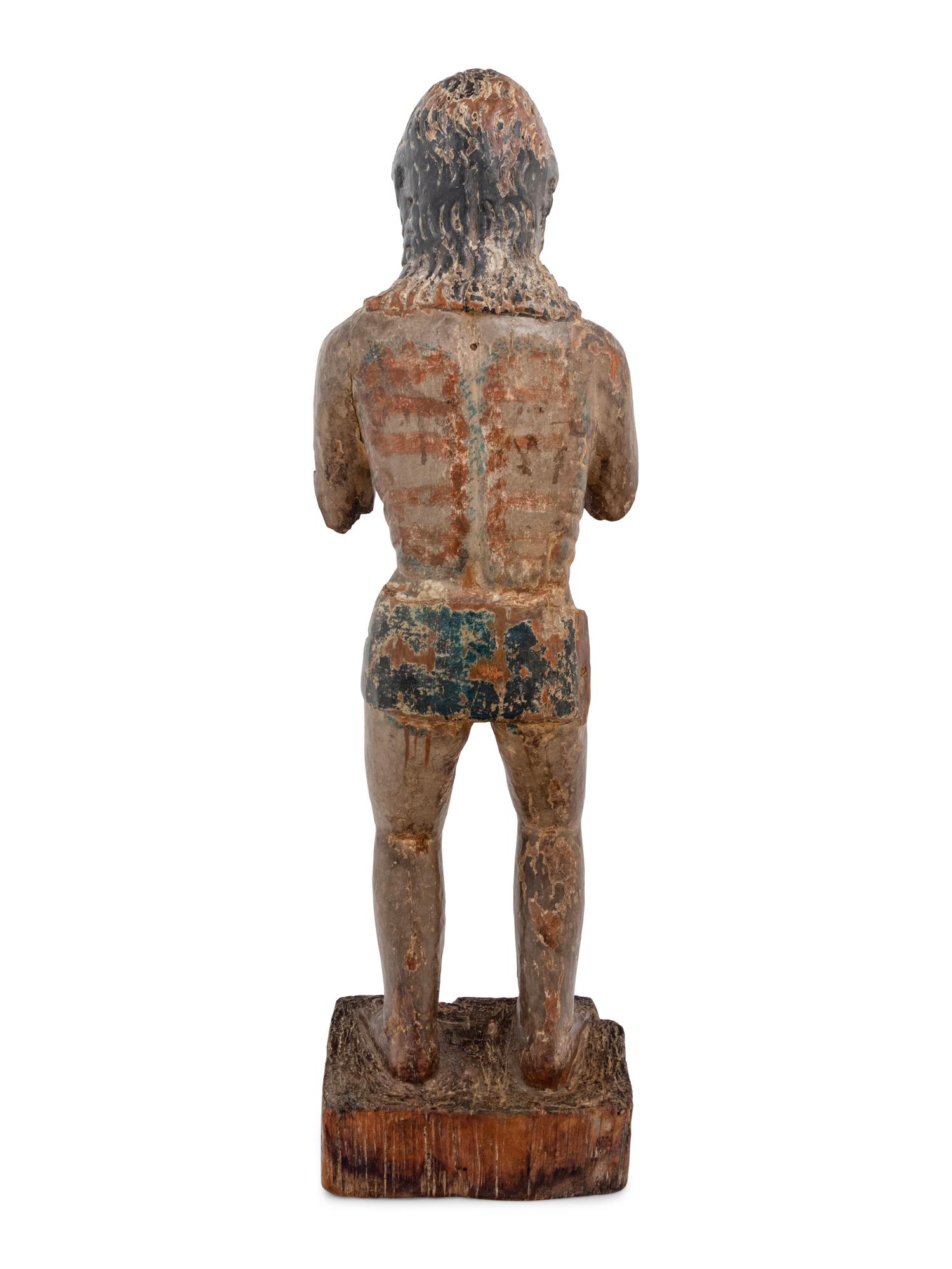 A Colonial Carved and Polychromed Figure of Christ