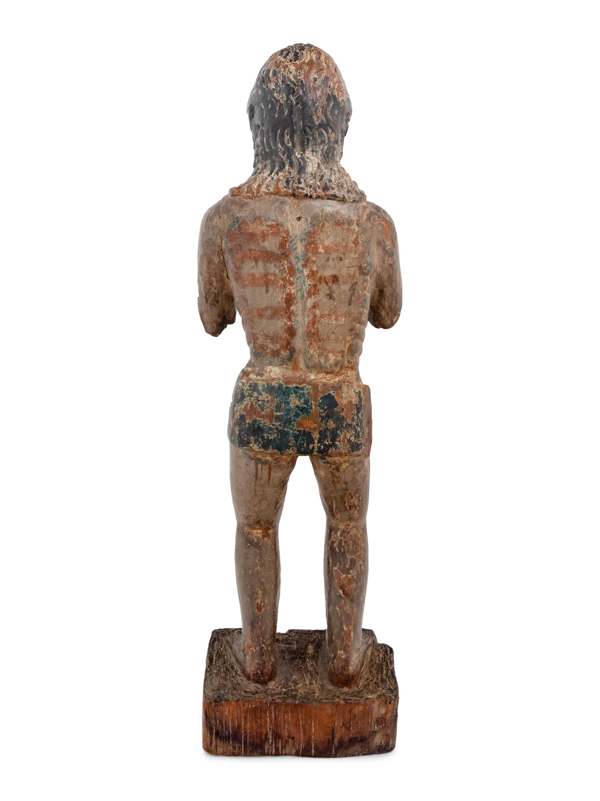 A Colonial Carved and Polychromed Figure of Christ