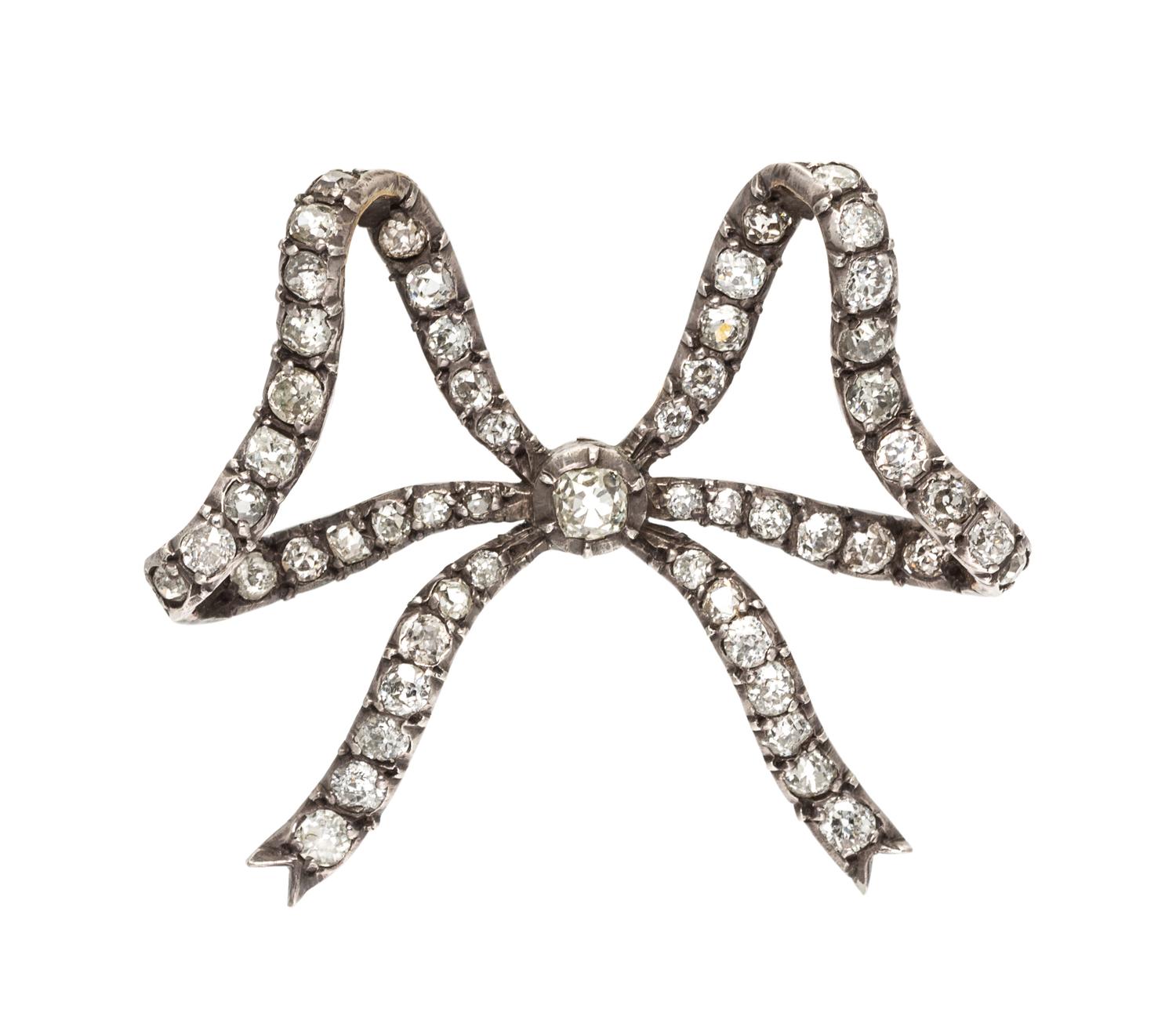 A Victorian Silver Topped Gold and Diamond Bow Brooch, 9.10 dwts.