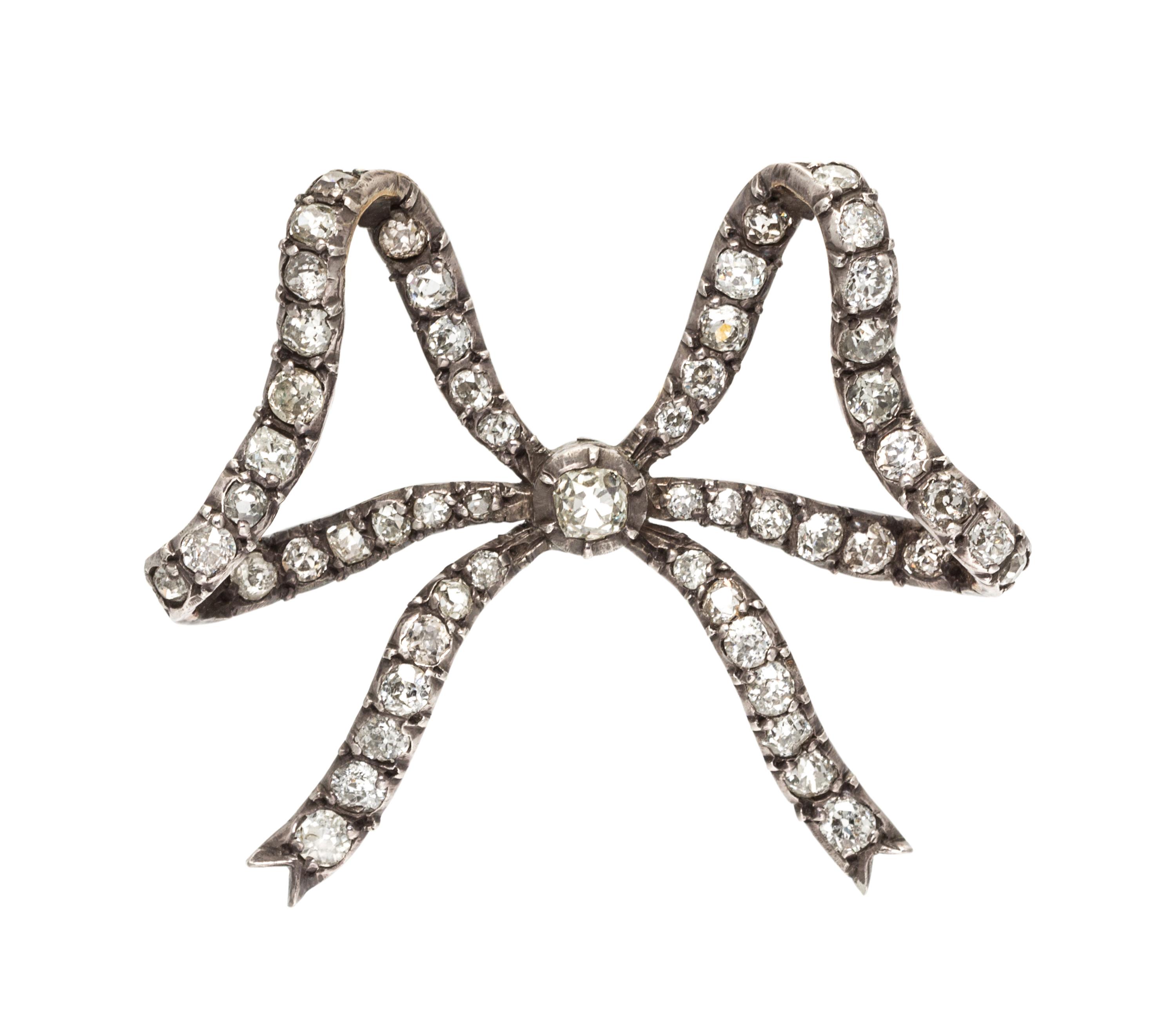 A Victorian Silver Topped Gold and Diamond Bow Brooch, 9.10 dwts.