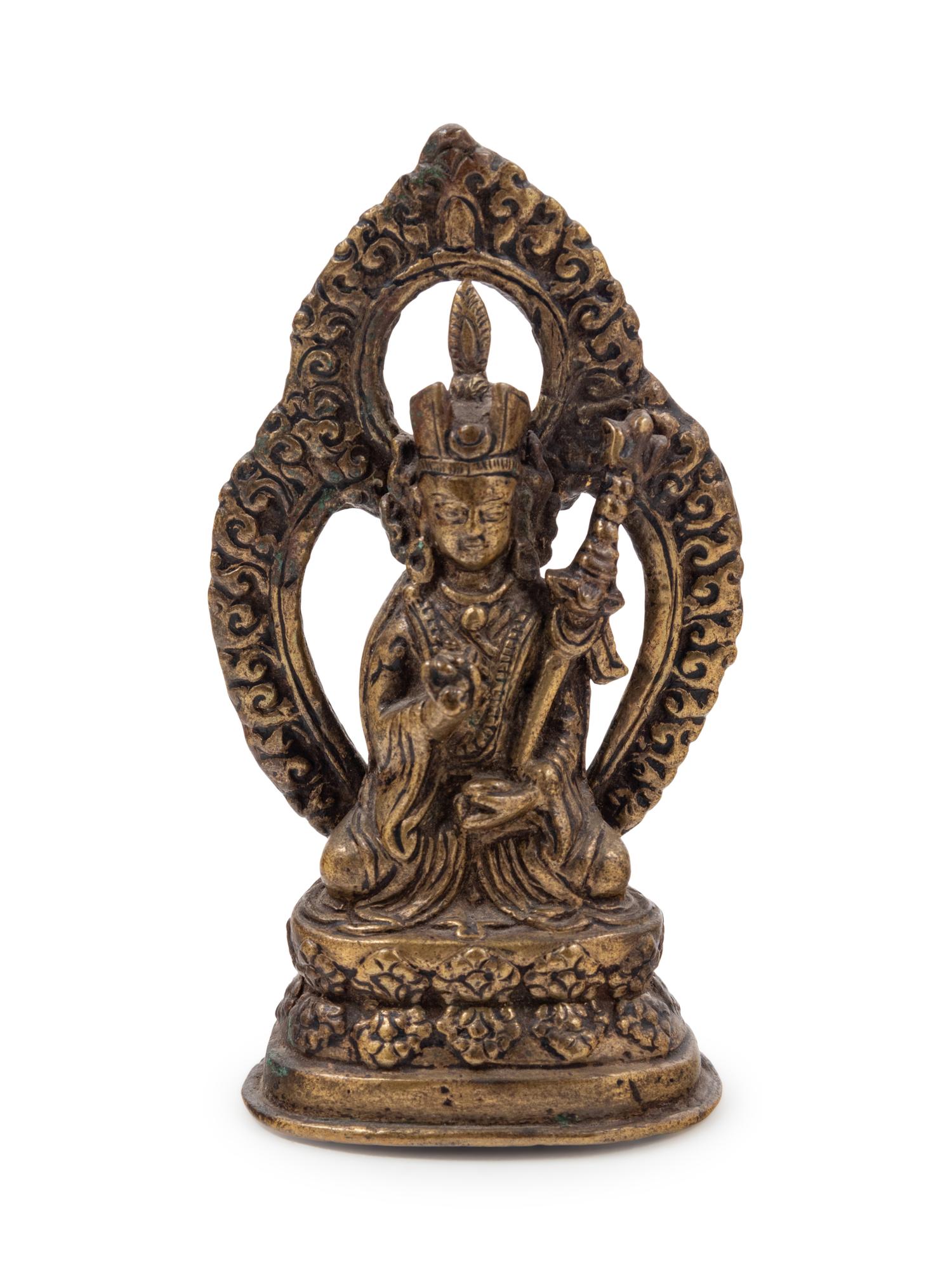 A Small Tibetan Gilt Bronze Figure of a Lama