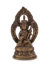 A Small Tibetan Gilt Bronze Figure of a Lama