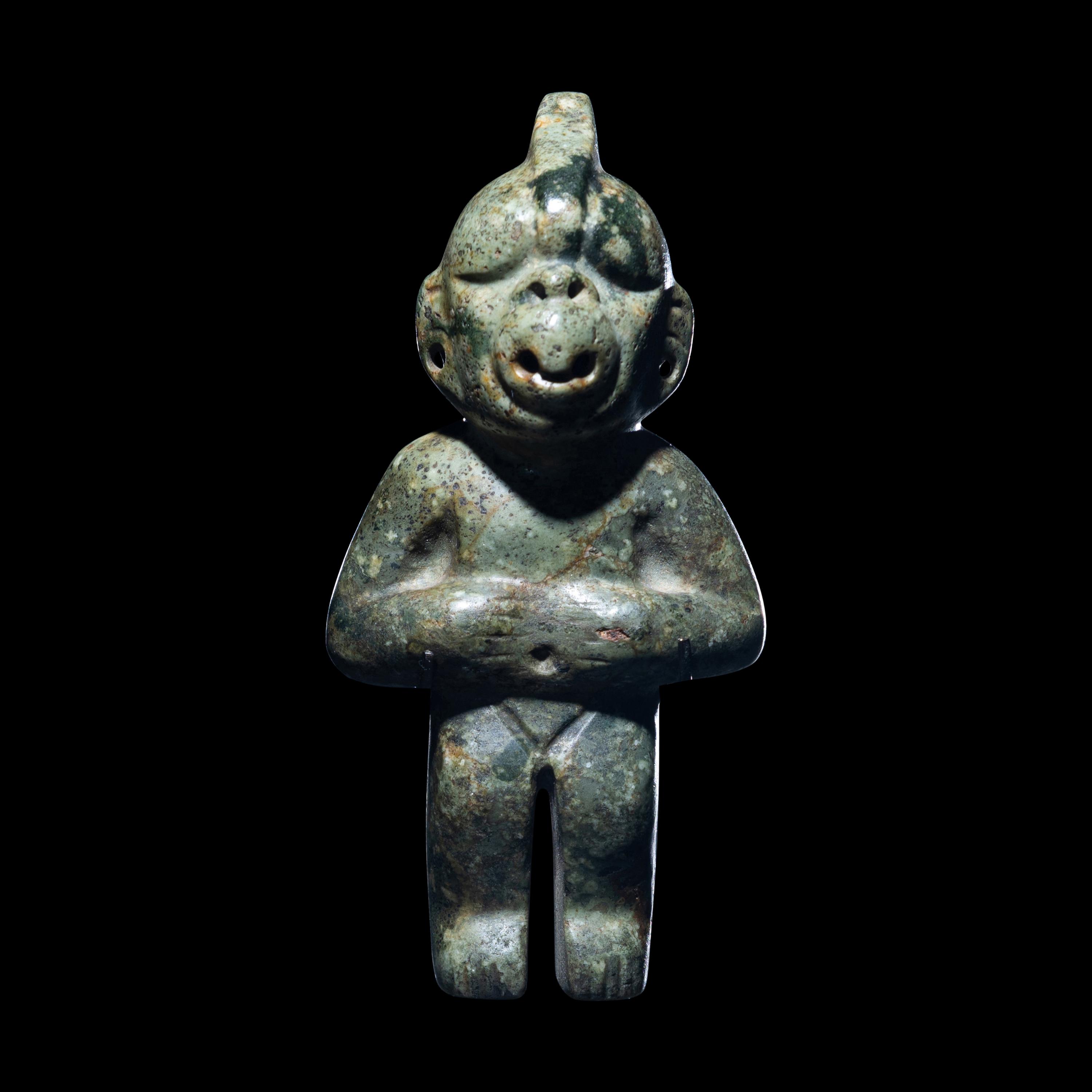 An Olmec Jade Transformation Figure