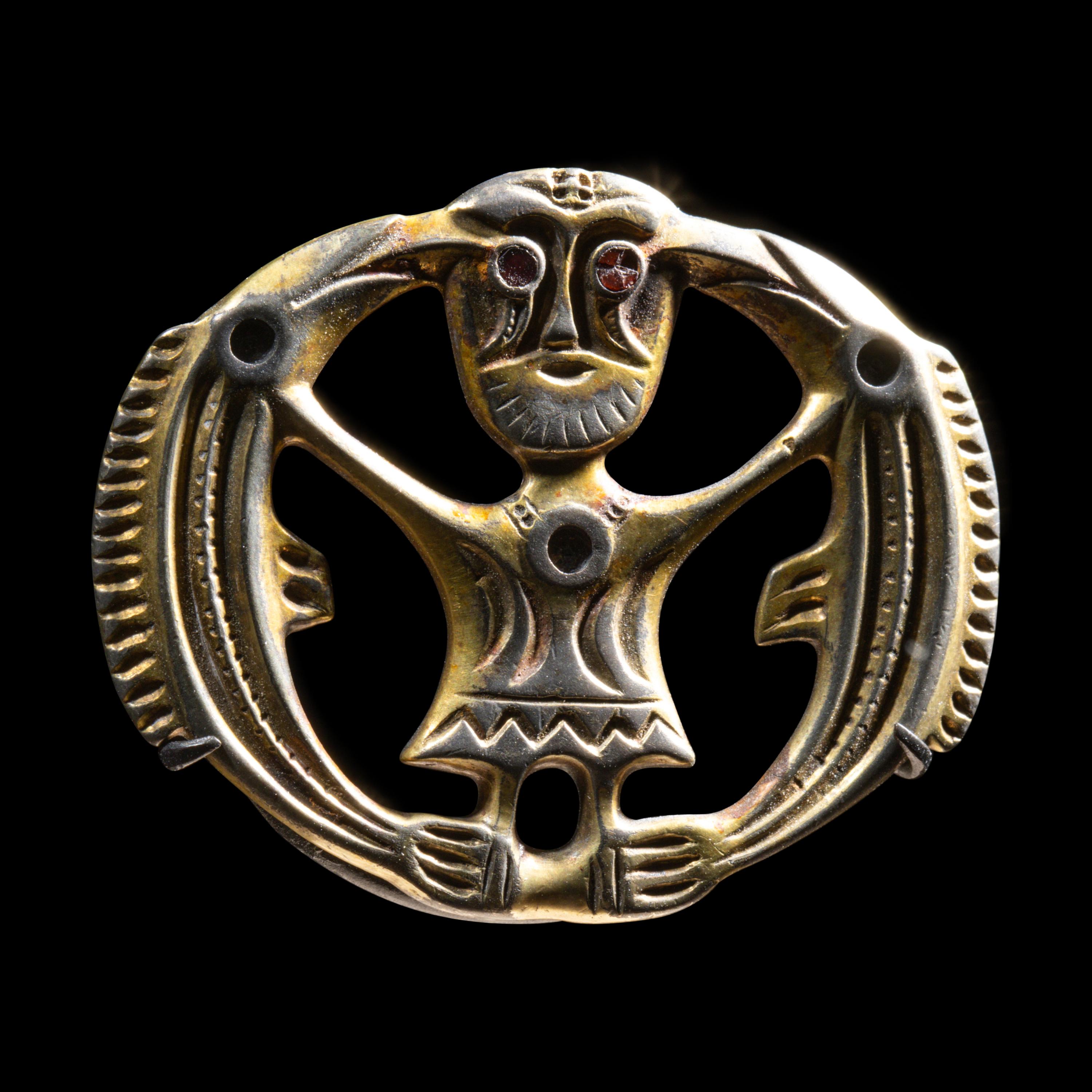 A Migration Period Gilt-Silver Brooch with Odin