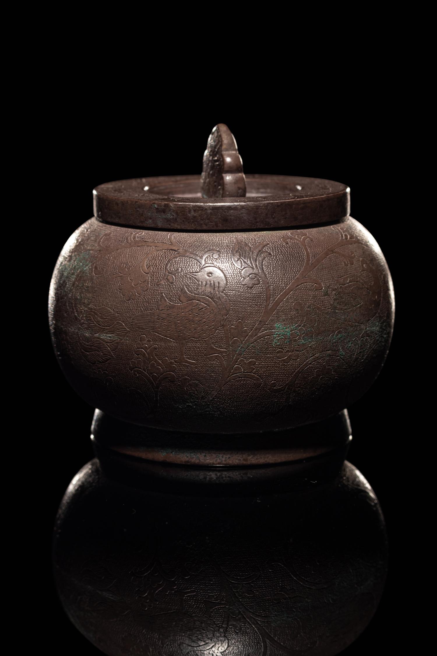 An Incised Silver Covered Jar